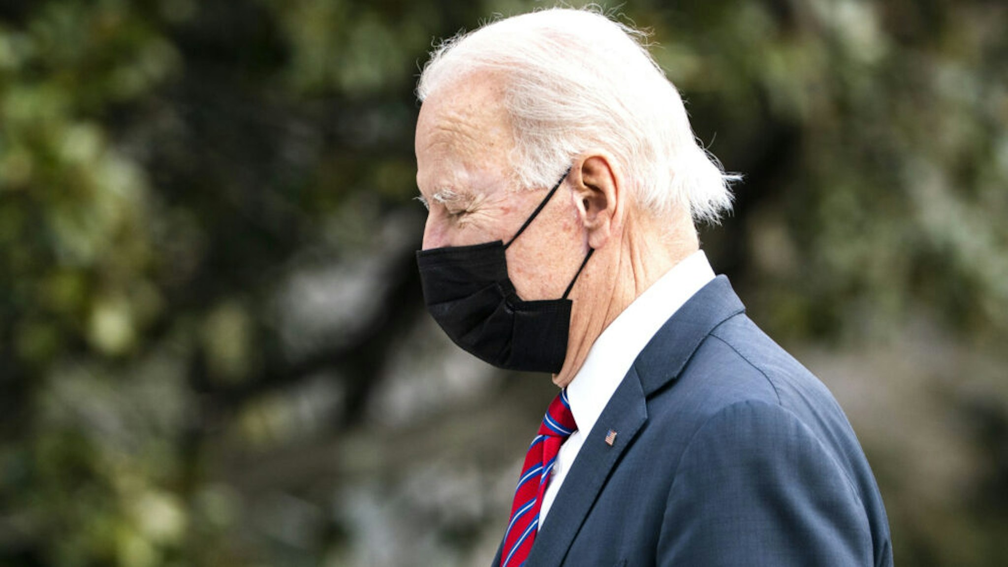 U.S. President Joe Biden walks on the South Lawn of the White House after arriving on Marine One in Washington, D.C., U.S., on Friday, Jan. 29, 2021. Biden moved to make it easier for Americans to buy health insurance during the pandemic, reopening the federal Obamacare marketplace with an order Thursday that's a step toward reinvigorating a program his predecessor tried to eliminate.