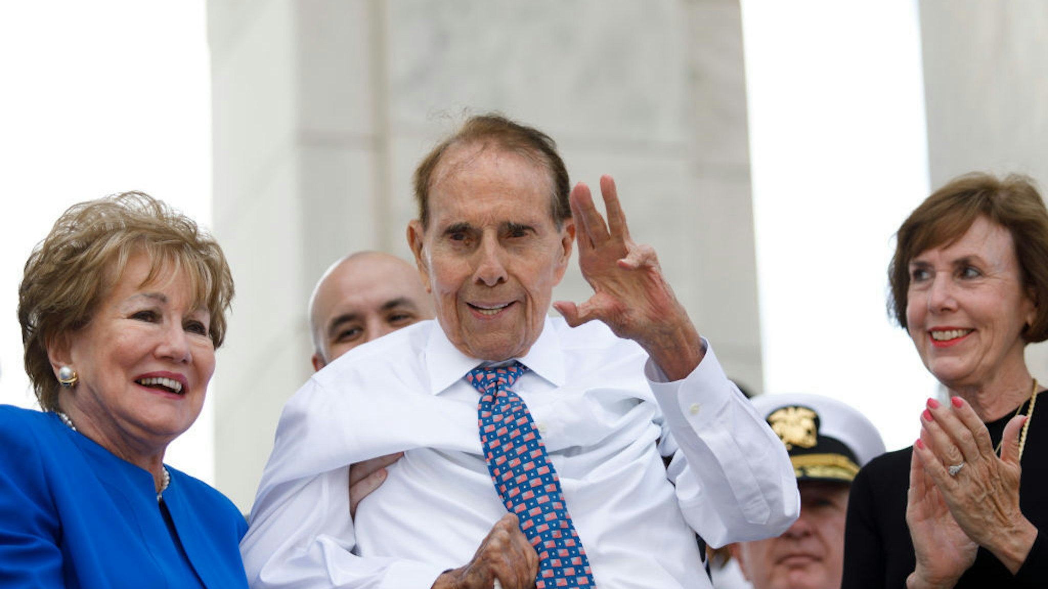 ARLINGTON, VA - MAY 27: Former Senator Bob Dole waves to the crowd after being noted in the audience by Vice President Mike Pence during a Memorial Day ceremony inside the Cemetery Amphitheater at Arlington National Cemetery on May 27, 2019 in Arlington, Virginia. (Photo by Tom Brenner/Getty Images)