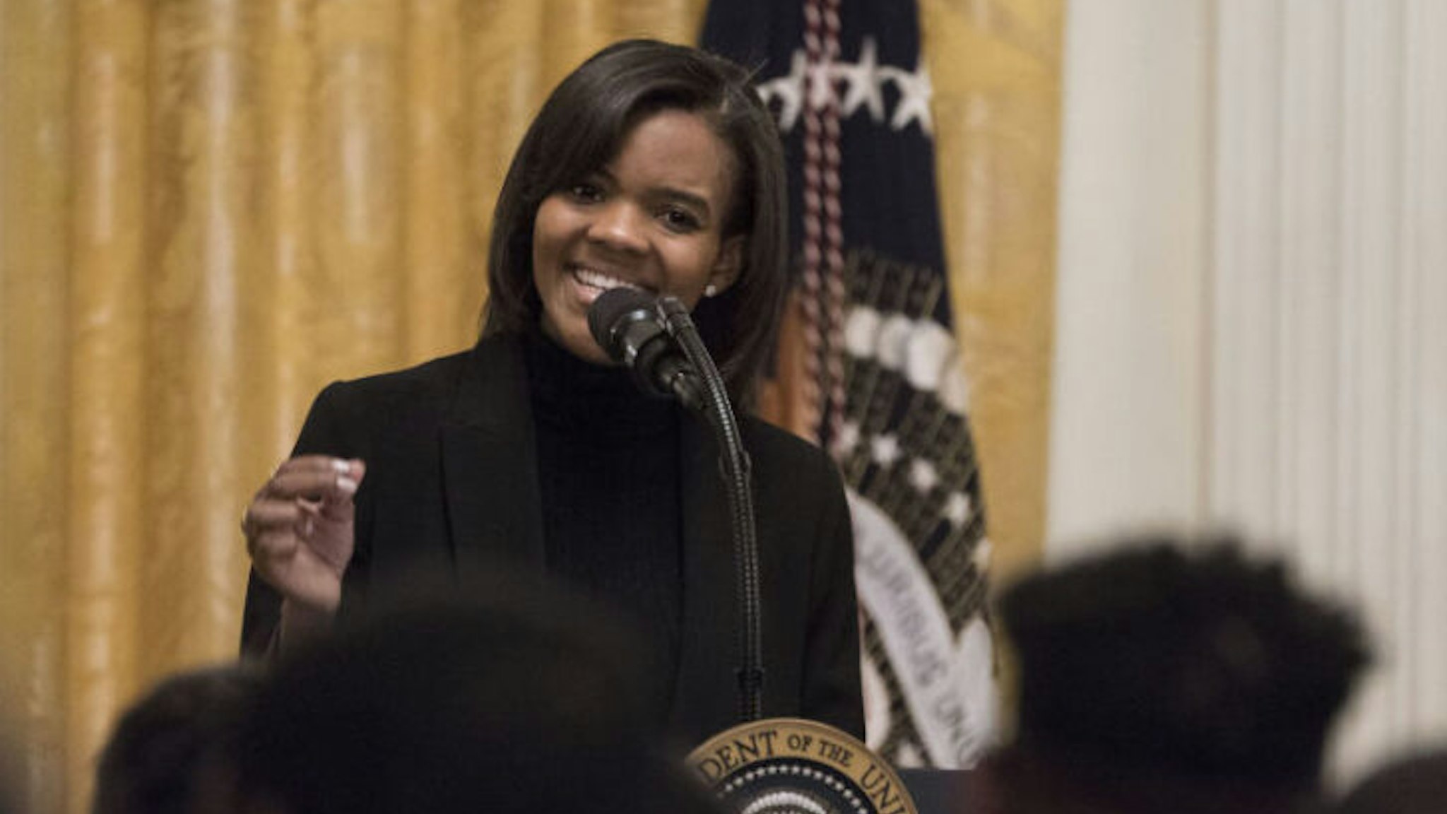Political commentator Candace Owens introduces U.S. President Donald Trump, not pictured, during the Young Black Leadership Summit 2019 event in the East Room of the White House in Washington, D.C., U.S., on Friday, Oct. 4, 2019. Two outside groups that support Trump have raised $6.9 million since House Democrats announced their impeachment inquiry last week. Photographer: Sarah Silbiger/Bloomberg