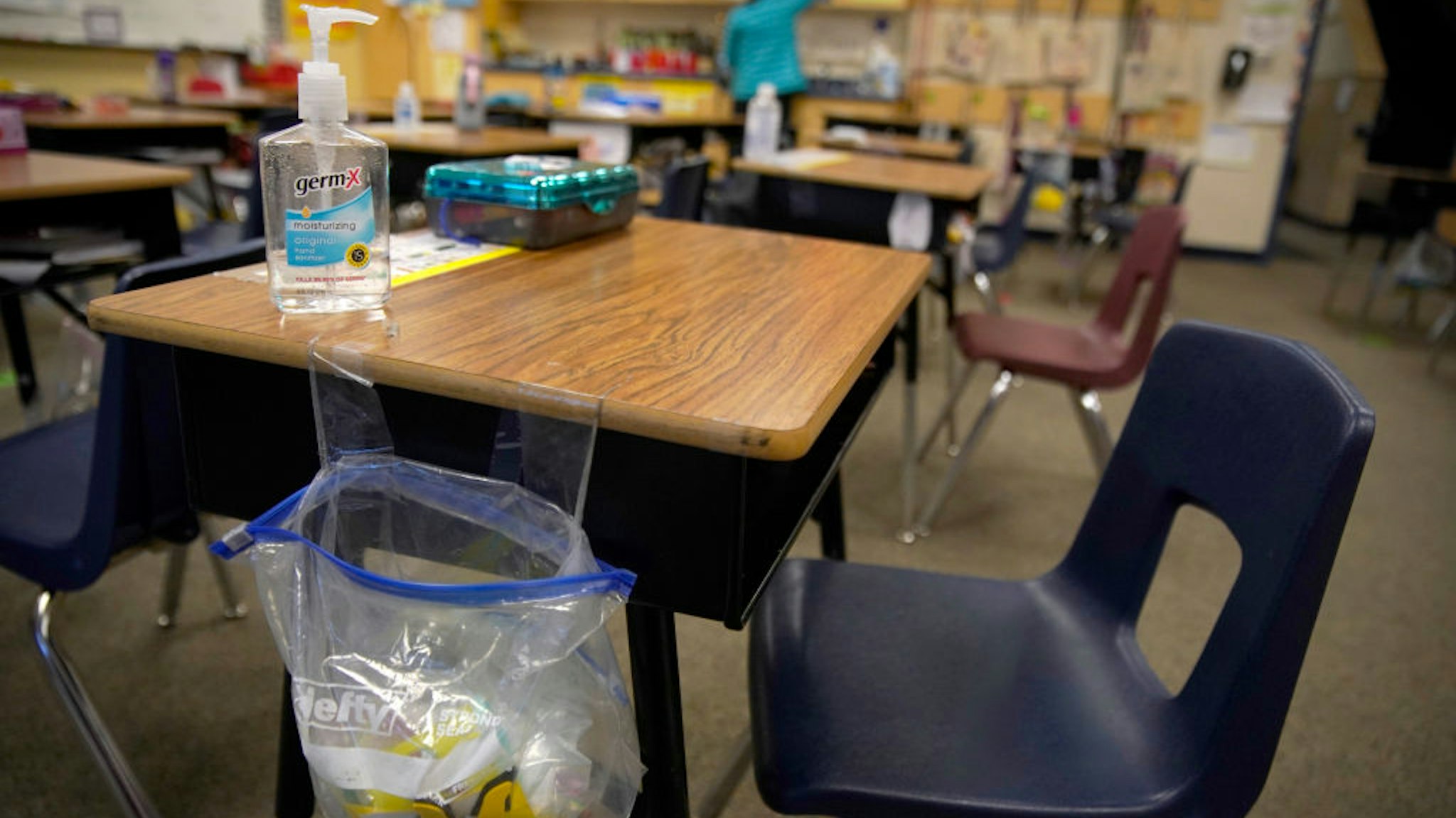A teacher prepares her classroom before students arrive for school at Freedom Preparatory Academy on February 10, 2021 in Provo, Utah. Freedom Academy has done in person instruction since the middle of August of 2020 with only four days of school canceled due to COVID-19 outbreak.