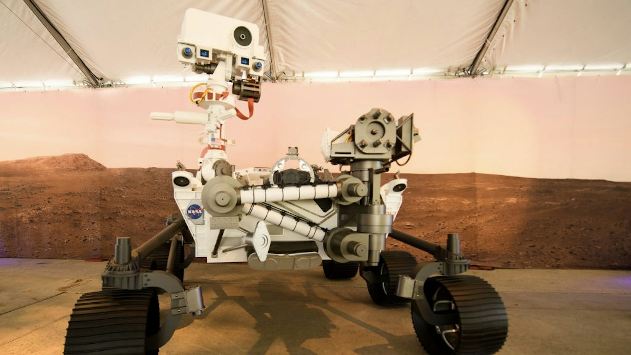 A full scale model of the Mars 2020 Perseverance rover is displayed at NASA's Jet Propulsion Laboratory (JPL) on February 16, 2021 in Pasadena, California. - The Mars exploration rover will search for signs of ancient microbial life and collect rock samples for future return to Earth to study the red planet's geology and climate, paving the way for human exploration. Perseverance also carries the experimental Ingenuity Mars Helicopter - which will attempt the first powered, controlled flight on another planet. (Photo by Patrick T. FALLON / AFP) (Photo by PATRICK T. FALLON/AFP via Getty Images)