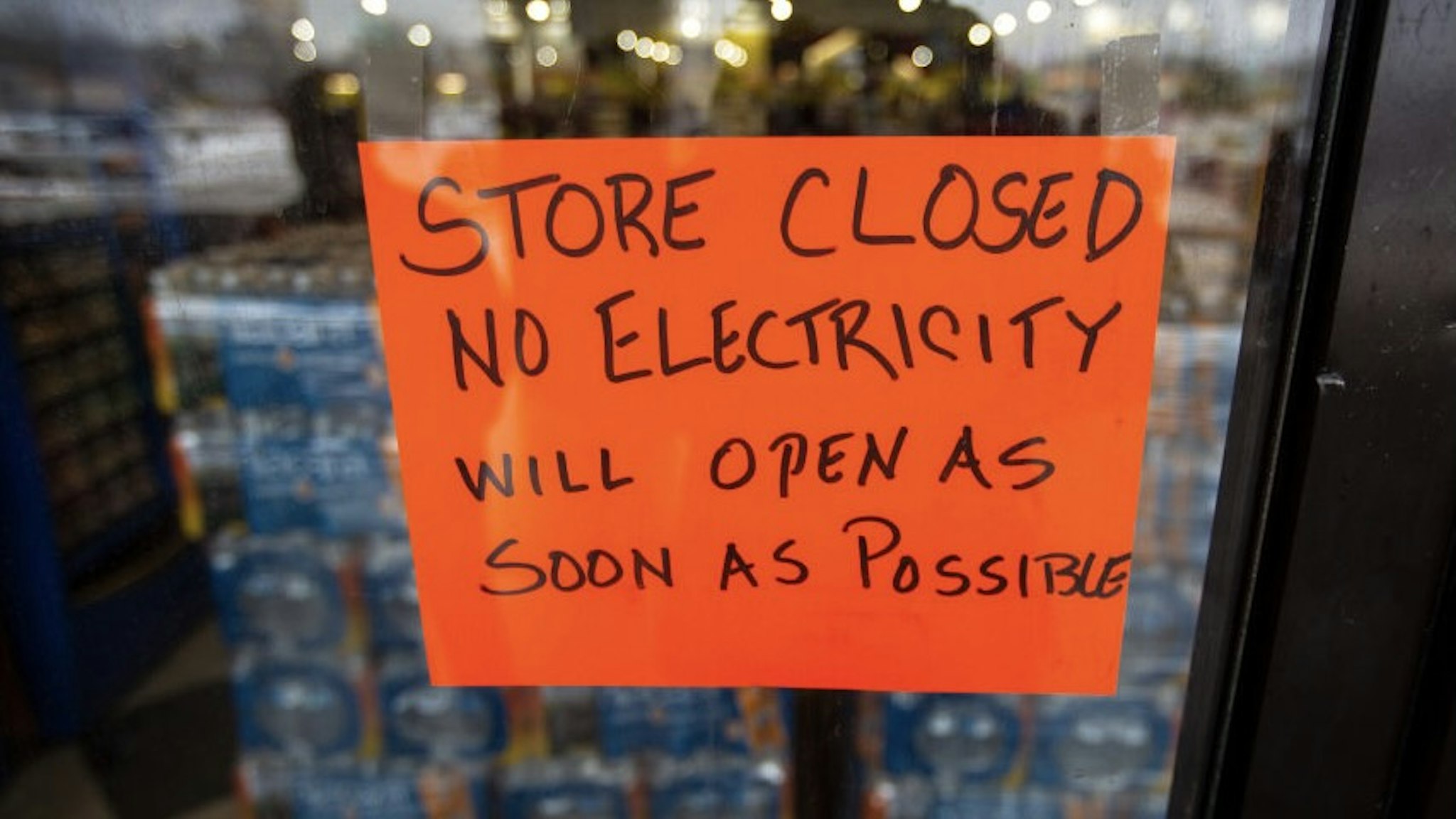 AUSTIN, TX - FEBRUARY 17, 2021: A sign states that a Fiesta Mart is closed because of a power outage in Austin, Texas on February 17, 2021. Millions of Texans are still without water and electric as winter storms continue. (Photo by Montinique Monroe/Getty Images)