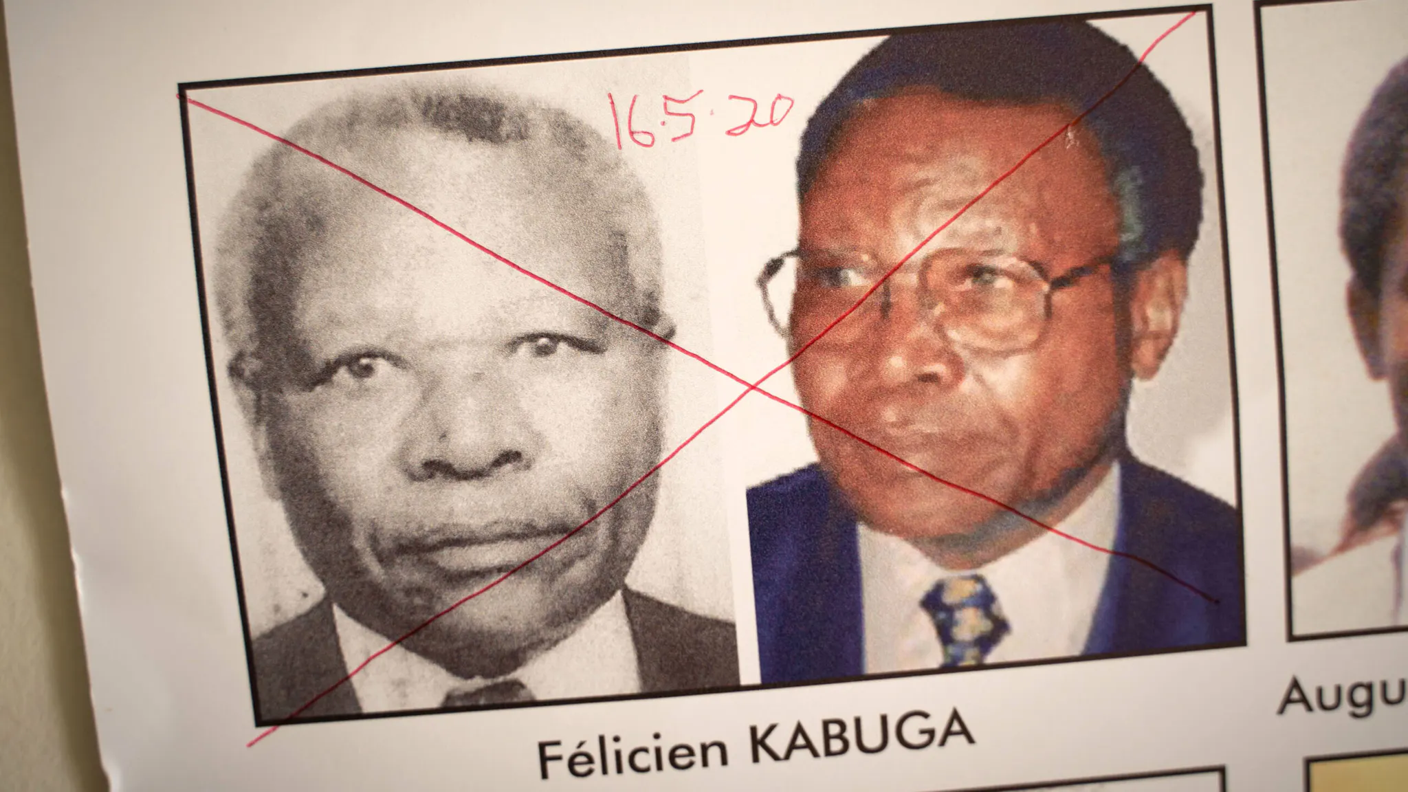 RWANDA-GENOCIDE-ARREST The date of arrest and a red cross are seen written on the face of Felicien Kabuga, one of the last key suspects in the 1994 Rwandan genocide, on a wanted poster at the Genocide Fugitive Tracking Unit office in Kigali, Rwanda, on May 19, 2020. - French police on May 16, 2020 arrested one of the last key suspects in the 1994 Rwandan genocide, describing him as its "financier" and one of the world's most wanted fugitives. Felicien Kabuga, once one of Rwanda's richest men, was living under a false identity in the Paris suburbs, the public prosecutor's office and police said in a joint statement.
