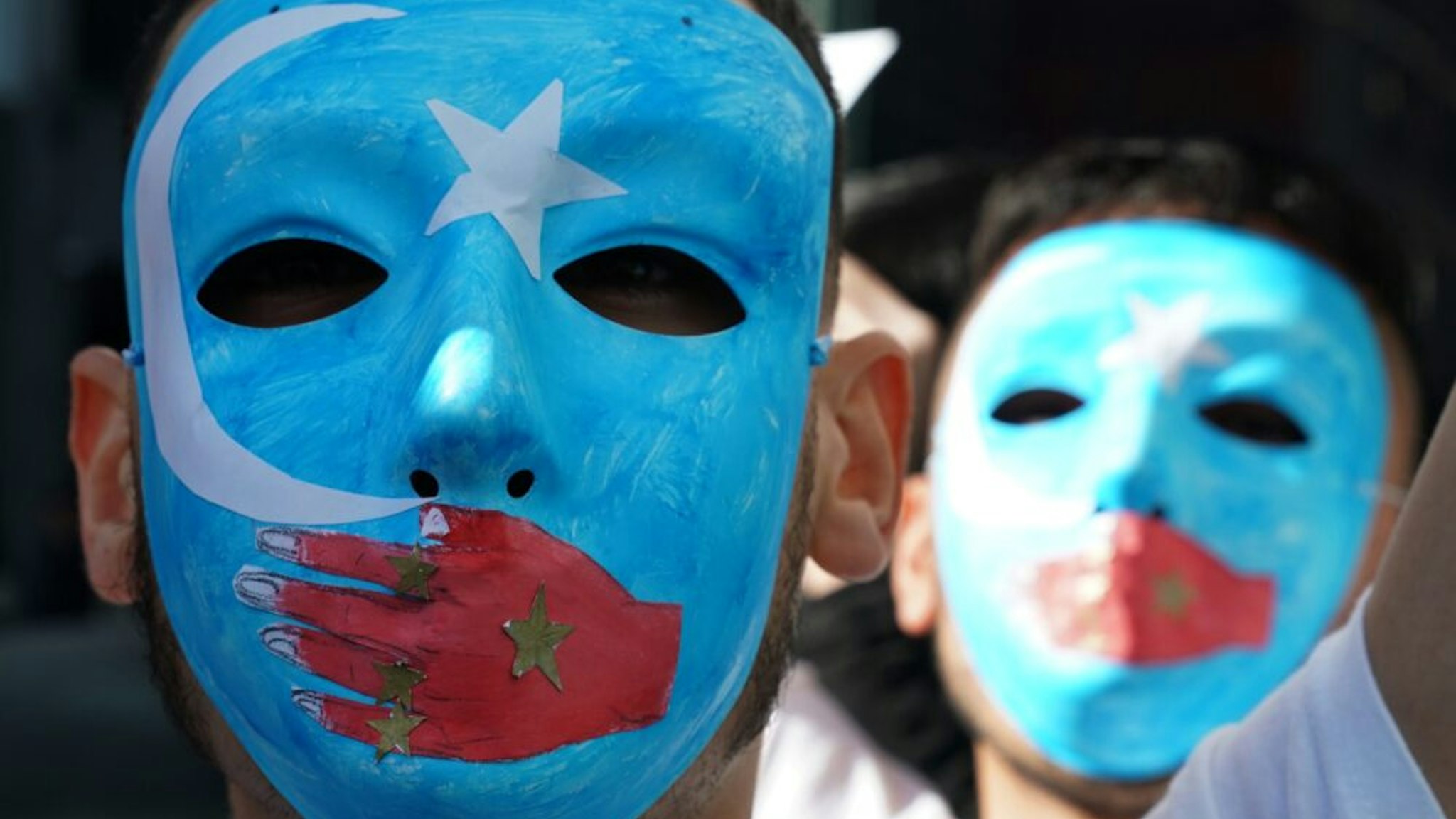 TOPSHOT - People protest at a Uyghur rally on February 5, 2019 in front of the US Mission to the United Nations, to encourage the State Department to fight for the freedom of the majority-Muslim Uighur population unjustly imprisoned in Chinese concentration camps.