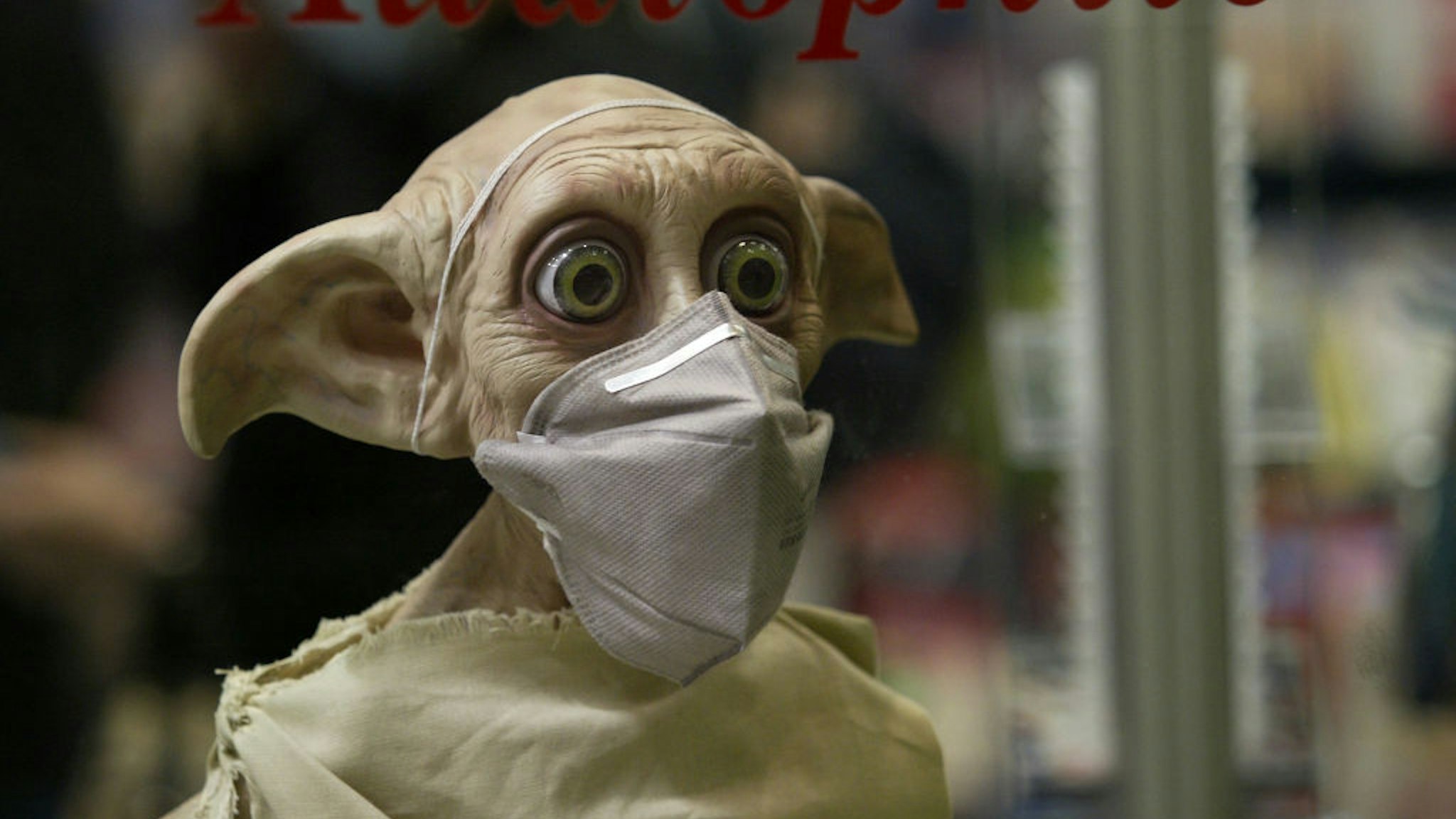 Dobby, character of film "Harry Potter" on display at HK records company, also wears a facemask, Pacific Place, Admiralty. 11 April 2003 (Photo by Dickson Lee/South China Morning Post via Getty Images)