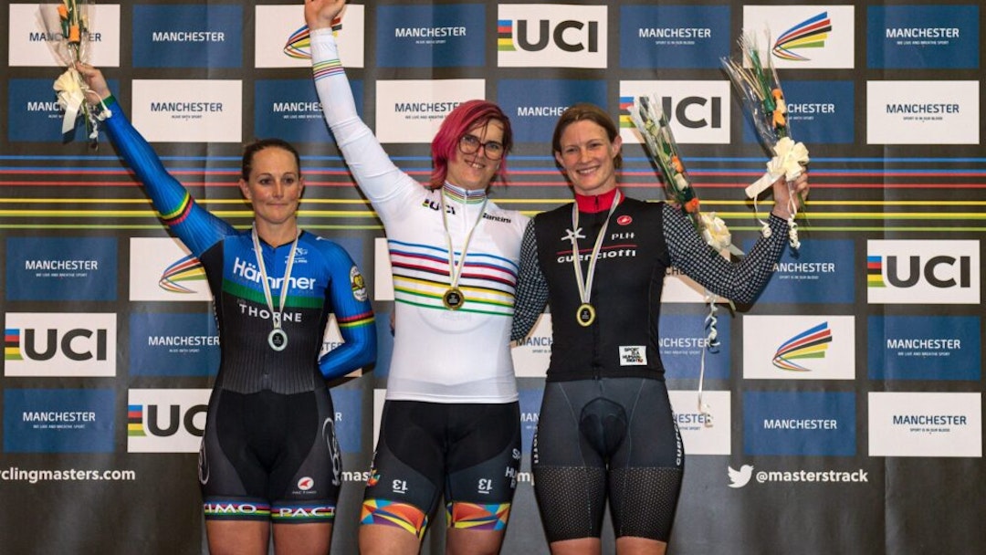 Canadian cyclist Rachel McKinnon (C) celebrates her gold medal on the podium with bronze medalist Kirsten Herup Sovang (R) of Denmark and silver medalist Dawn Orwick (L) of the USA, for the F35-39 Sprint discipline of the UCI Masters Track Cycling World Championships, in Manchester on October 19, 2019. - Transgender cyclist Rachel McKinnon has defended her right to compete in women's sport despite accepting trans athletes may retain a physical advantage over their rivals.
