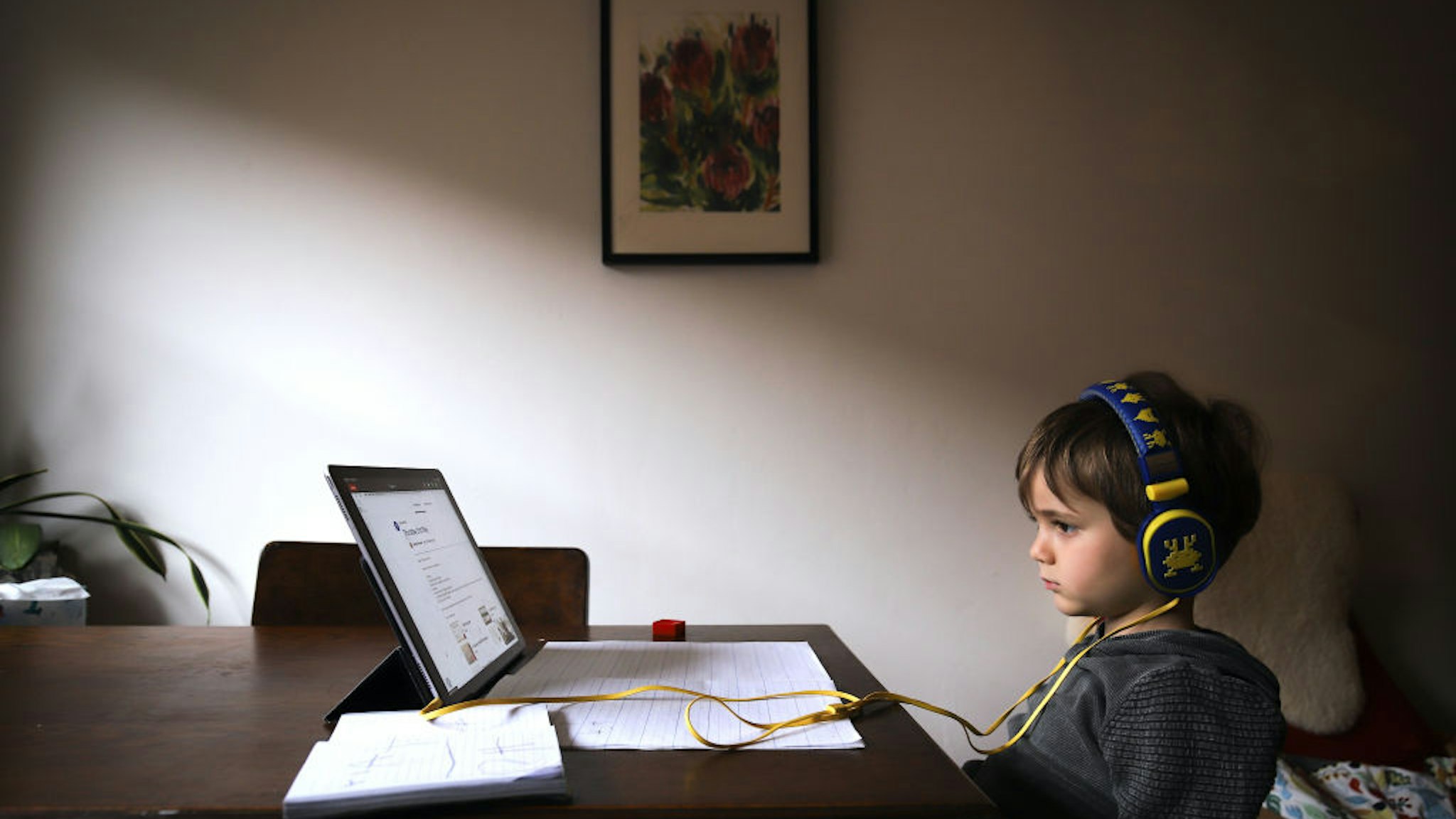 SYDNEY, AUSTRALIA - MAY 21: Six-year-old Kaya Atayman sits in front of his computer as he does homeschooling at his home in the suburb of Bondi on May 21, 2020 in Sydney, Australia. Students in New South Wales return to regular lessons today, after a week of staggered lessons, as COVID-19 restrictions ease across Australia. (Photo by David Gray/Getty Images)