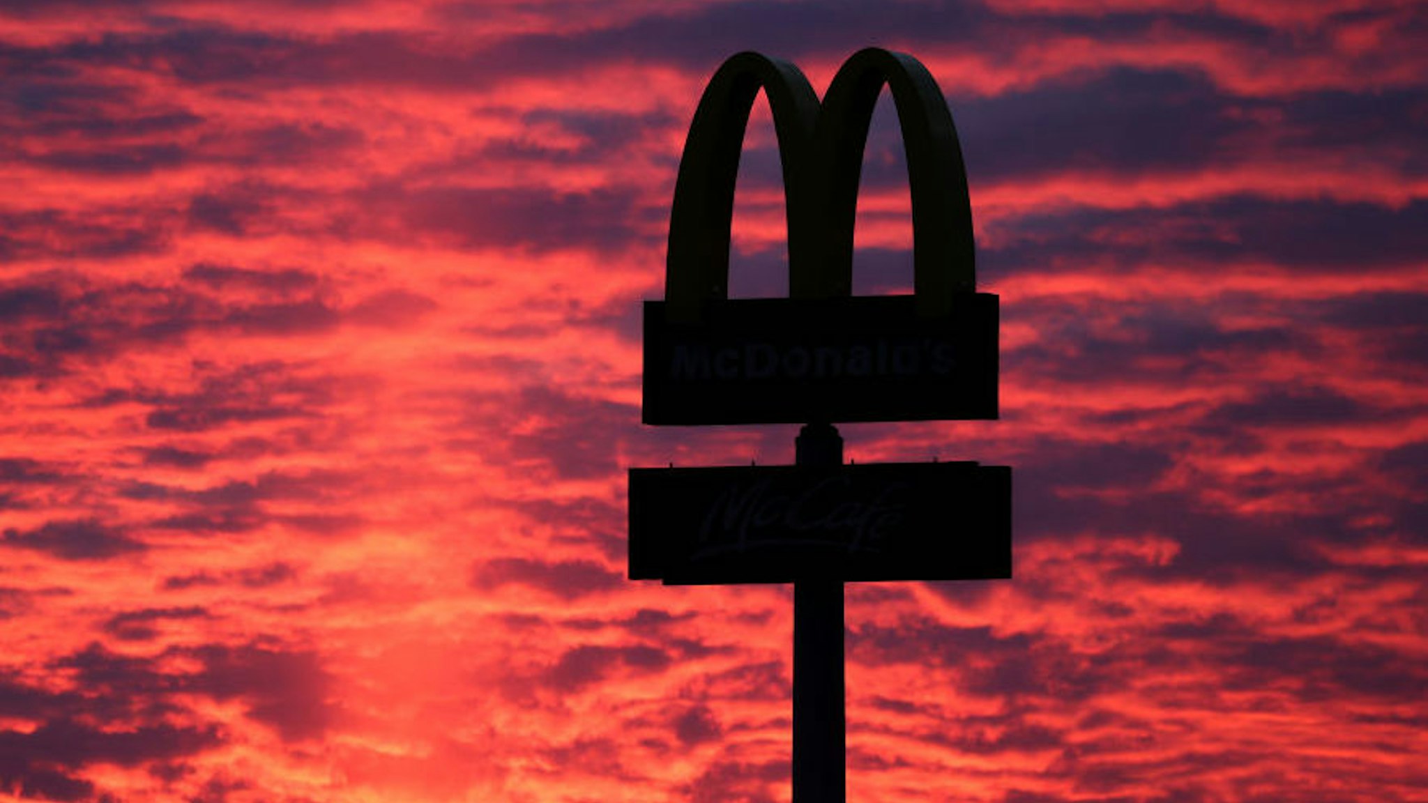 30 November 2020, Thuringia, Gera: The evening sky shines behind a McDonalds-M. Photo: Jan Woitas/dpa-Zentralbild/ZB (Photo by Jan Woitas/picture alliance via Getty Images)
