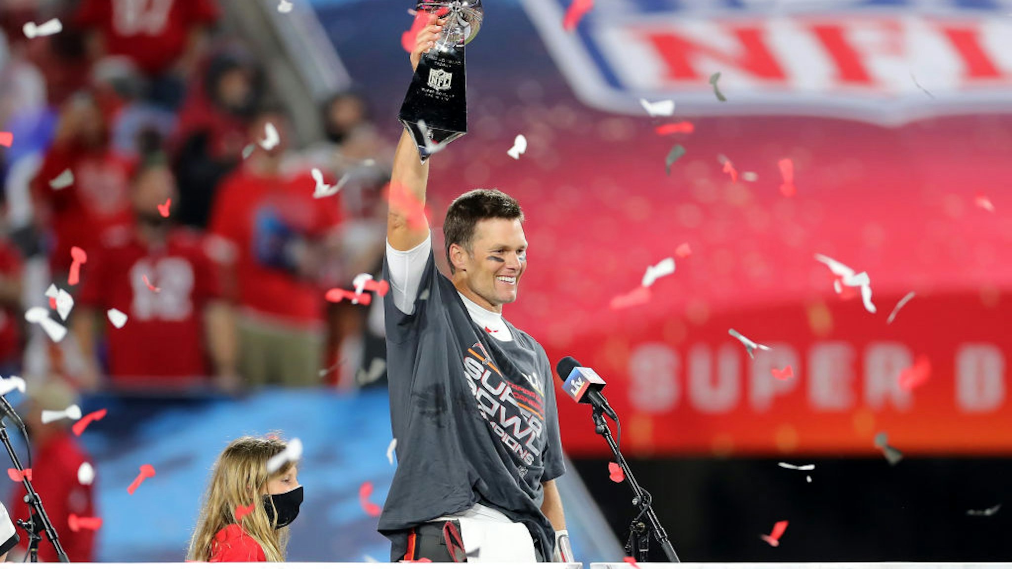 TAMPA, FL - FEBRUARY 07: Super Bowl MVP Tom Brady (12) of the Buccaneers hoists the Lombardi Trophy after the Super Bowl LV game between the Kansas City Chiefs and the Tampa Bay Buccaneers on February 7, 2021 at Raymond James Stadium, in Tampa, FL. (Photo by Cliff Welch/Icon Sportswire via Getty Images)