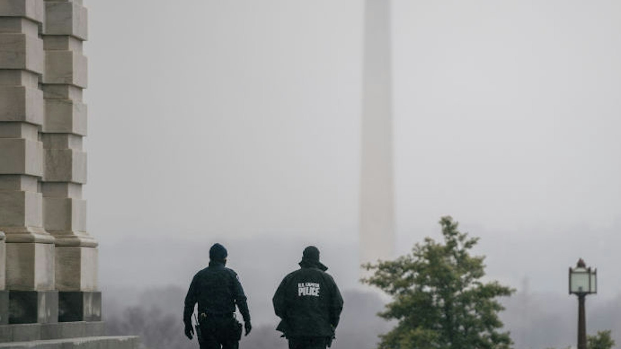 WASHINGTON, DC - FEBRUARY 13: Capitol Police officers patrol the U.S. Capitol grounds following the conclusion of the second impeachment trial of former President Donald Trump on February 13, 2021 in Washington, DC. The Senate voted 57-43 to acquit Trump. (Photo by Brandon Bell/Getty Images)