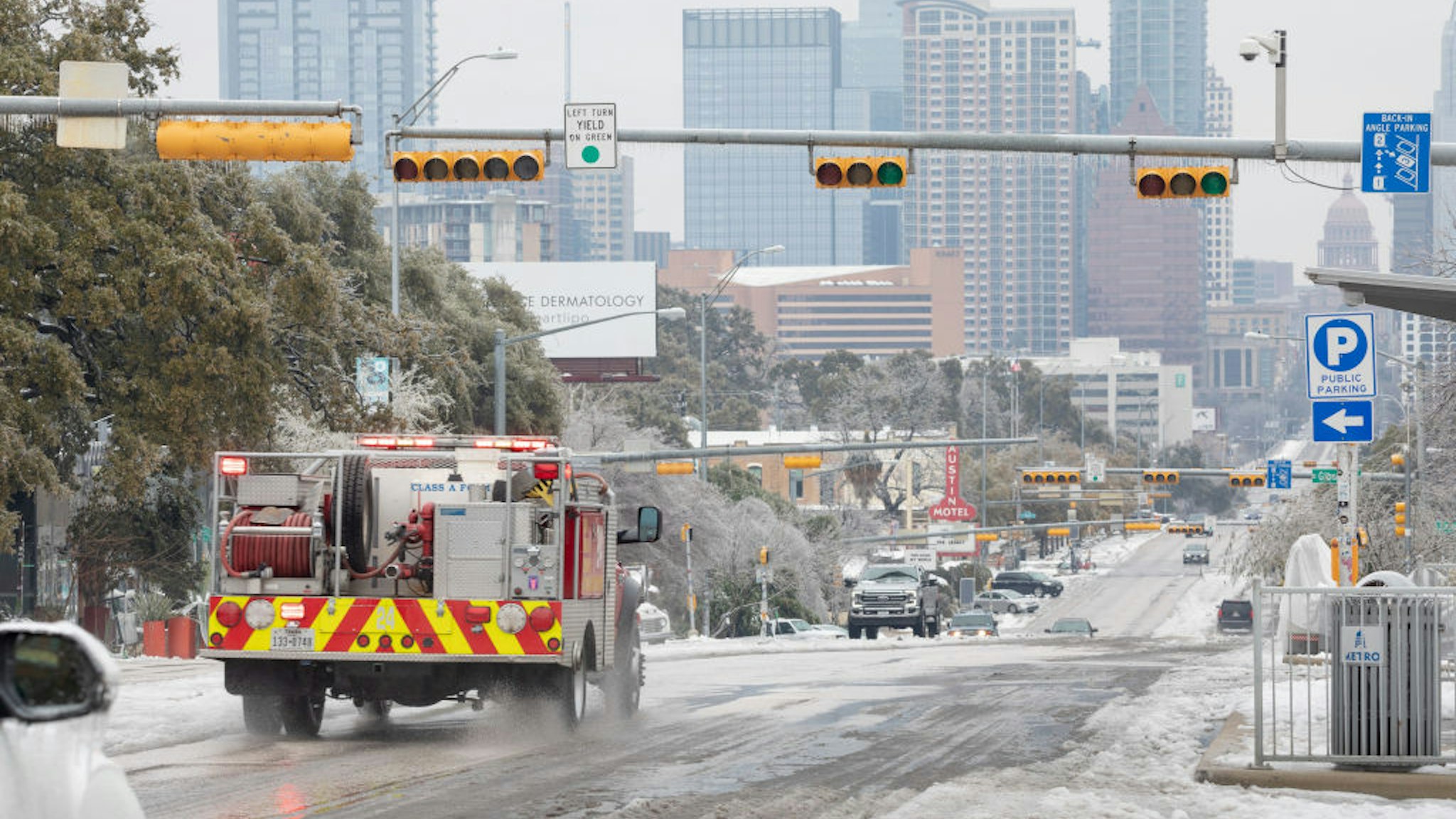 A firetruck drives down Congress Avenue in Austin, Texas, U.S., on Wednesday, Feb. 17, 2021. The crisis that has knocked out power for days to millions of homes and businesses in Texas and across the central U.S. is getting worse, with blackouts expected to last until at least Thursday. Photographer: Thomas Ryan Allison/Bloomberg via Getty Images