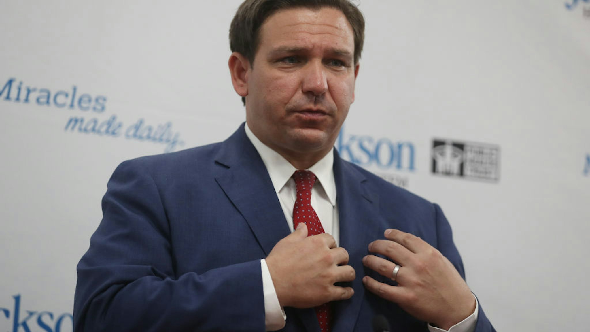 Florida Gov. Ron DeSantis speaks at a new conference on the surge in coronavirus cases in the state held at the Jackson Memorial Hospital on July 13, 2020 in Miami, ` of COVID-19 as the state of Florida tries to contain the recent spike.