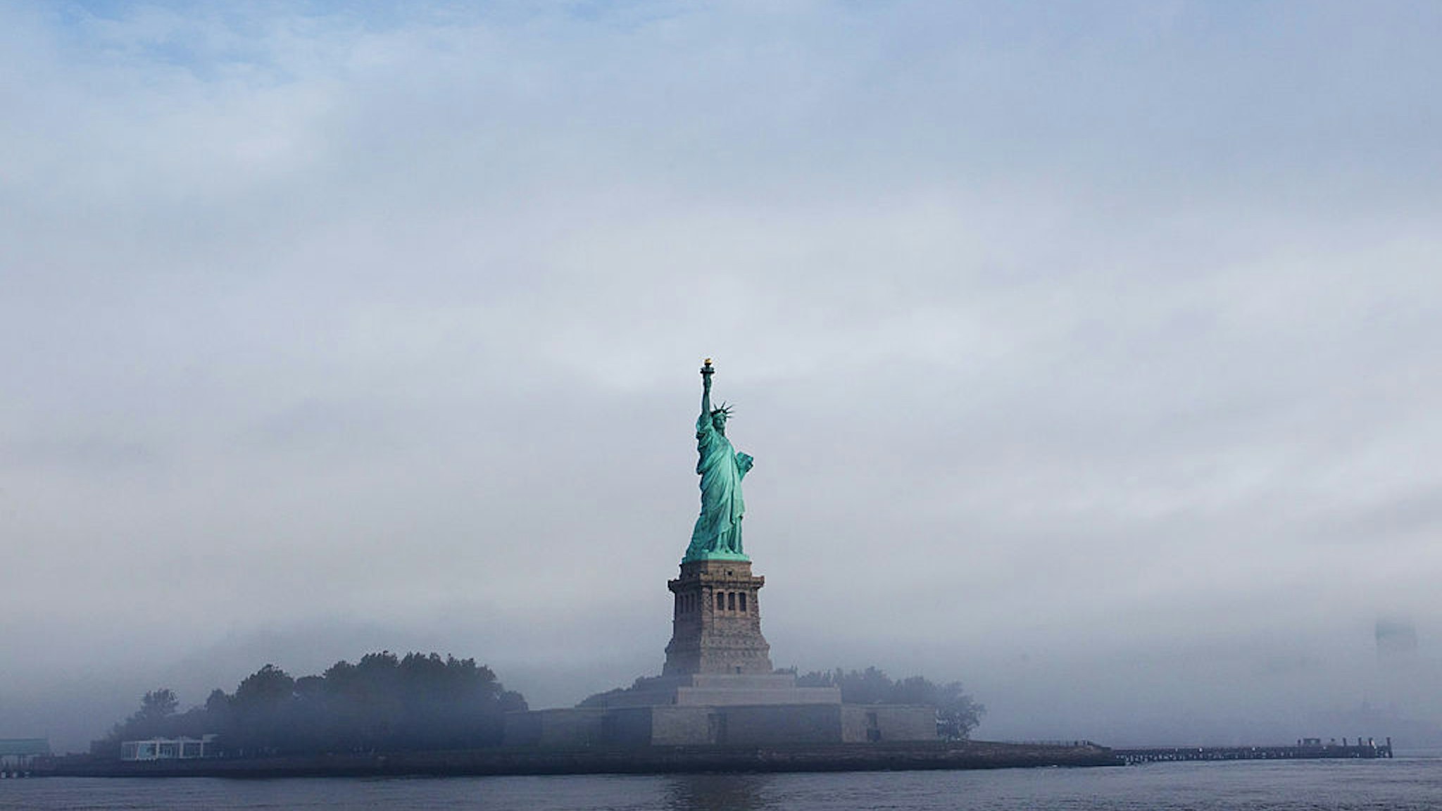 NEW YORK CITY- SEPTEMBER 22: The Statue of Liberty is seen through fog prior to the start of the 125th Anniversary of the Statue of Liberty ceremony on Liberty Island on September 22, 2011 in New York City. The 125th Anniversary of the Statue of Liberty is to be celebrated on October 28th, 2011. (Photo by Daniel Berehulak/Getty Images)