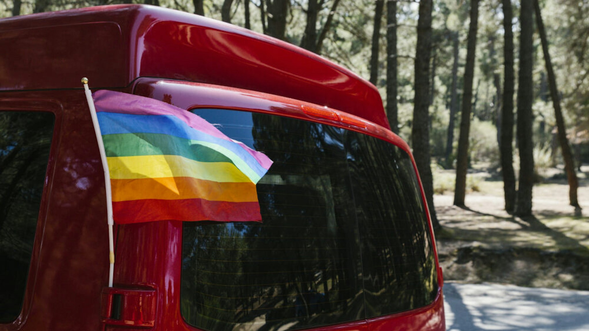 Campervan with an LGBT pride flag - Stock photo