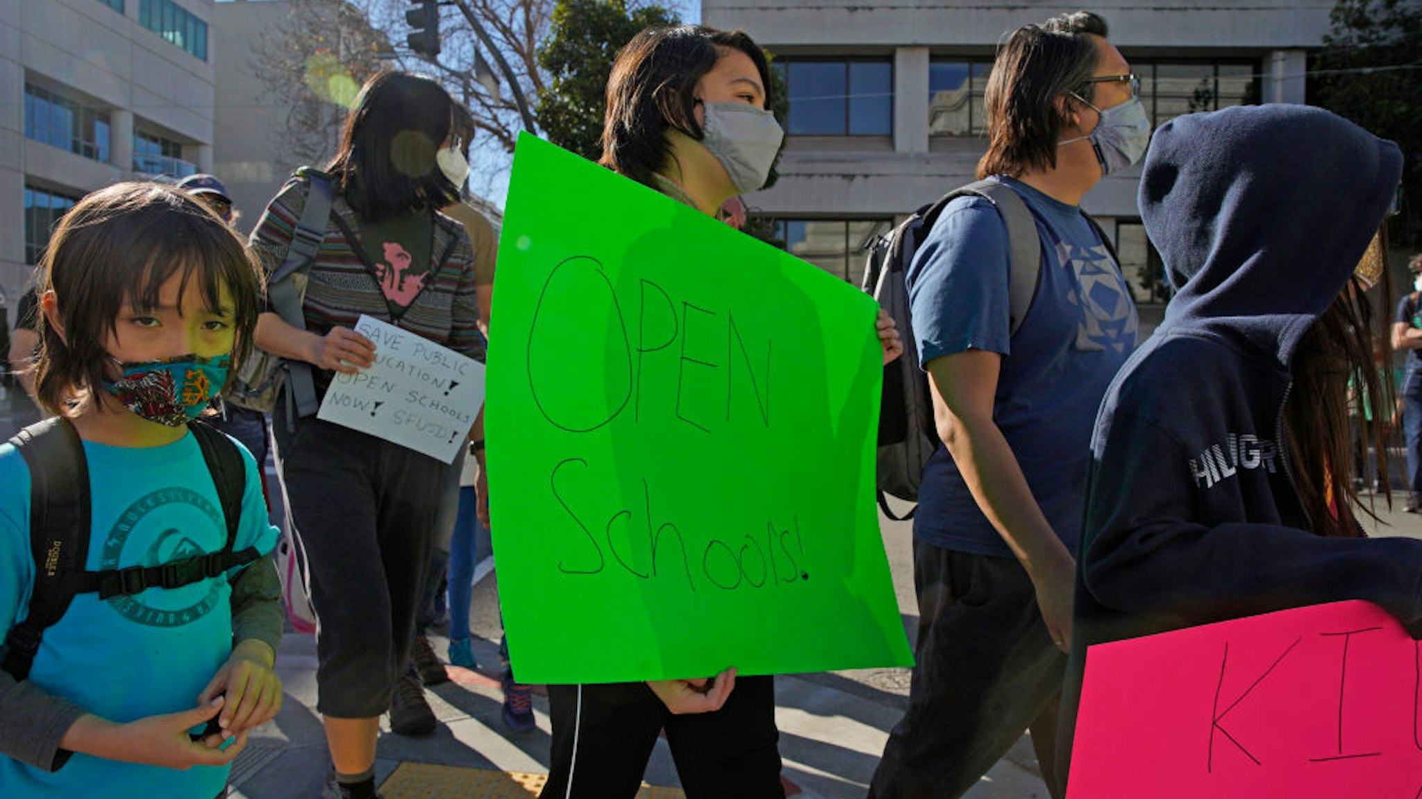 Calder Law, 12, who attends Roosevelt Middle School, marches back to City Hall after a rally outside the SFUSD building, Saturday, Feb. 6, 2021, in San Francisco, Calif.