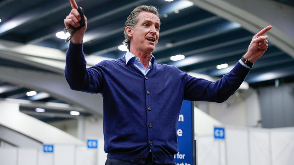 Governor Gavin Newsom speaks to the press at the Moscone Center vaccination site on Friday, Feb. 12, 2021 in San Francisco, California.