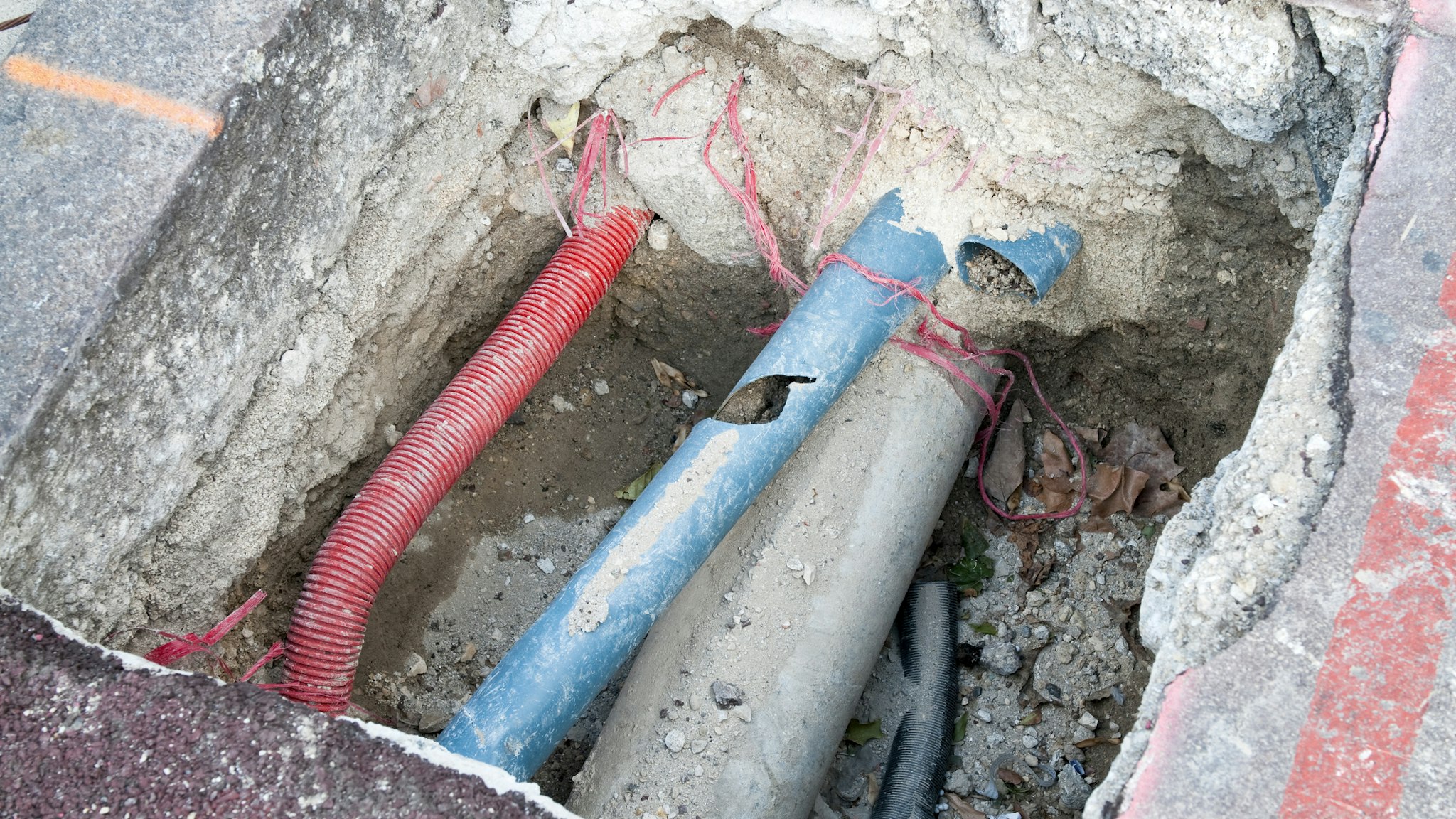 A public utility pipe needing repair work.