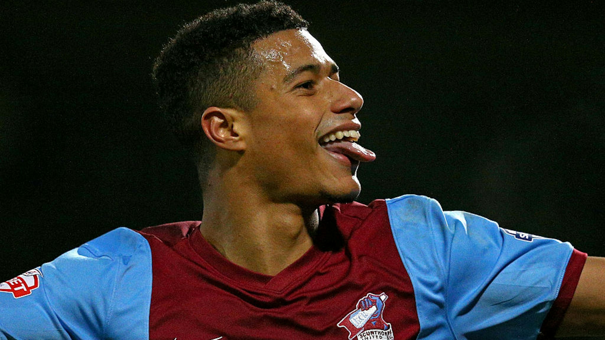 Lyle Taylor of Scunthorpe celebrates after scoring his team's second goal during the FA Cup Third Round match between Scunthorpe United and Chesterfield FC at Glanford Park on January 6, 2015 in Scunthorpe, England.
