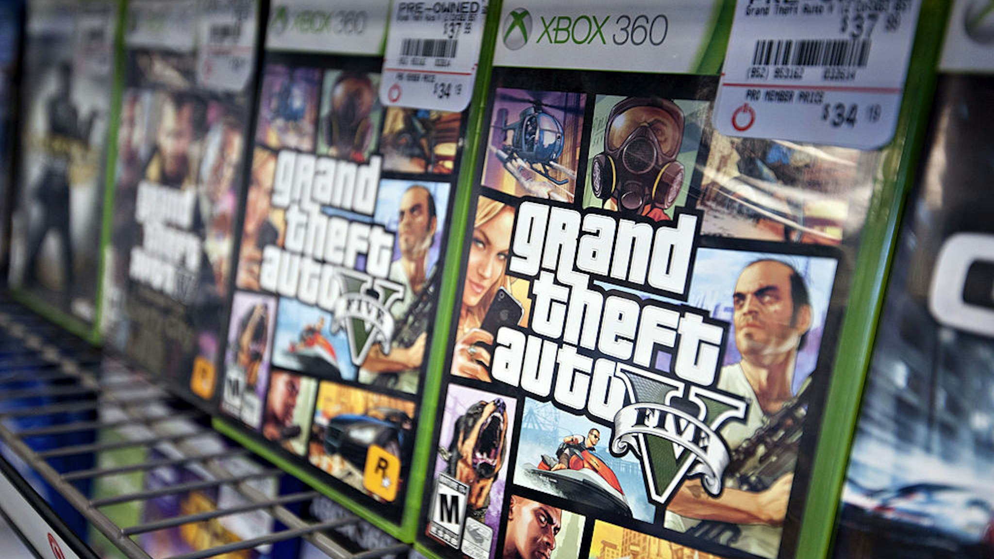 Copies of Take-Two Interactive Software Inc. "Grand Theft Auto V" for the Microsoft Corp. Xbox 360 game system sit on display for sale at a GameStop Corp. store in Peru, Illinois, U.S., on Wednesday, March 26, 2014.