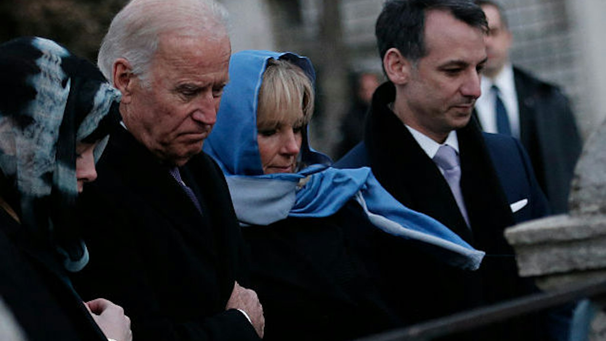 US Vice President Joe Biden (2nd L) flanked by his wife Jill (2nd R), his granddaughter Naomi Biden (L), and son-in-law Howard Krein (R) pays tribute on January 22, 2016 in Istanbul, to the victims of the January 12 bomb attack, where ten German tourists were killed, in the historic Sultanahmet district of Istanbul.