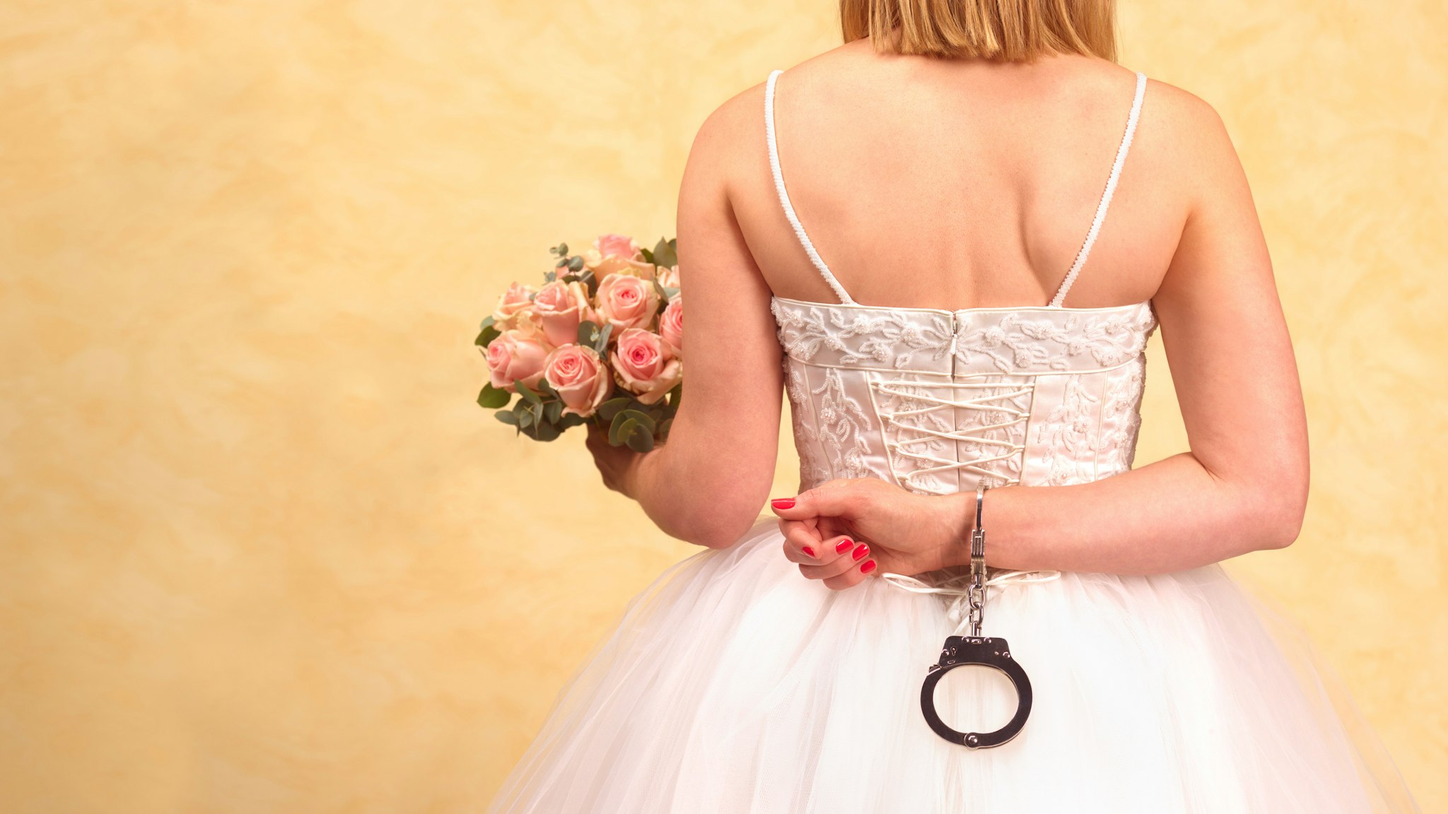 Bride in hand cuffs