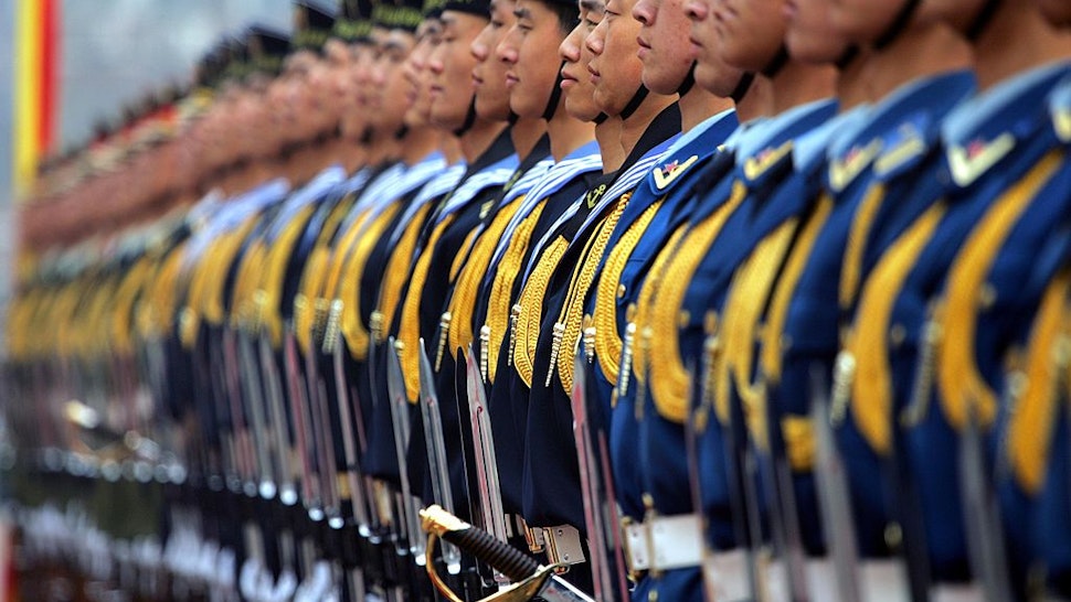 BEIJING, CHINA - MARCH 22: The Chinese honor guard awaits inspection during the welcome ceremony for U.S. Chairman of the Joint Chief of Staff, Marine Gen. Peter Pace, at the Defense Ministry in March 22, 2007 Beijing, China. The Pentagon's top general arrived in Beijing today on a visit aimed at expanding military-to-military links, including joint search-and-rescue exercises and courses bringing together junior officers. (Photo by Elizabeth Dalziel - Pool/Getty Images)