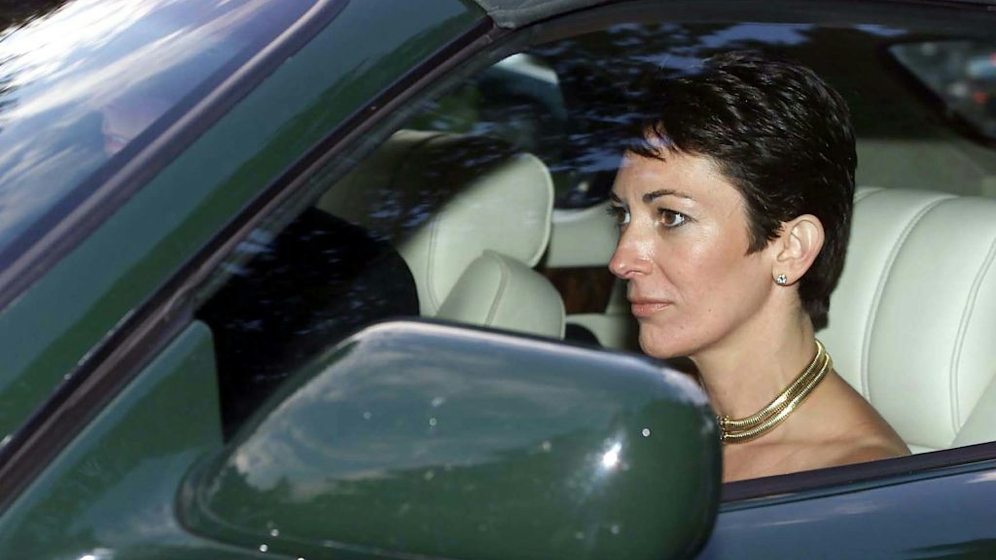 Ghislaine Maxwell with the Duke of York leaves the wedding of a former girlfriend of the Duke, Aurelia Cecil, at the Parish Church of St Michael in Compton Chamberlayne near Salisbury with .