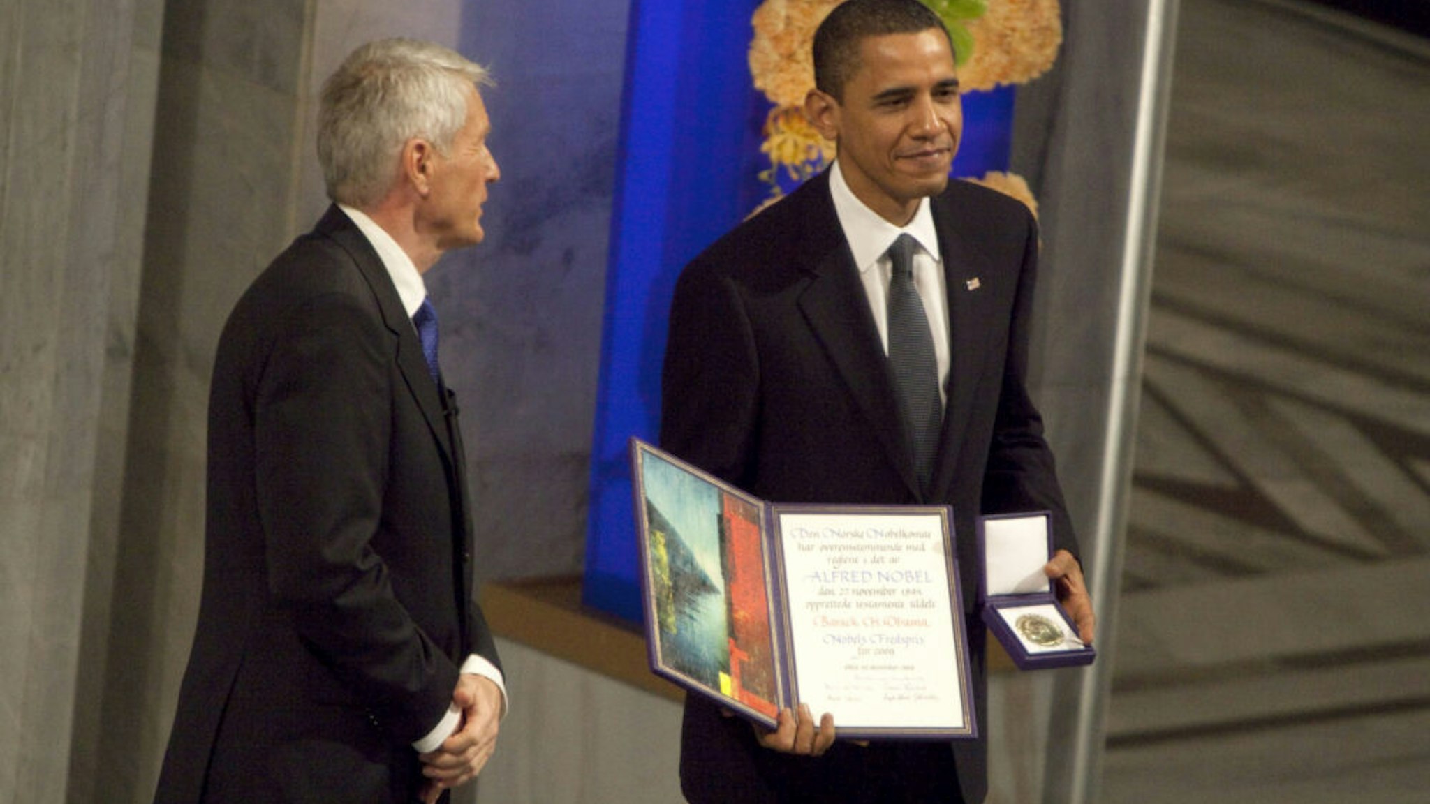 U.S. President Barack Obama, right, receives the Nobel Peace Prize from Thorbjoern Jagland, chairman of the Nobel committee, during a ceremony in Oslo, Norway, on Thursday, Dec.10, 2009. Obama accepted the Nobel Peace Prize, saying he is humbled by the award and receives it with an 'acute sense' of the cost of war.