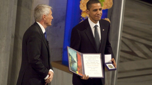 U.S. President Barack Obama, right, receives the Nobel Peace Prize from Thorbjoern Jagland, chairman of the Nobel committee, during a ceremony in Oslo, Norway, on Thursday, Dec.10, 2009. Obama accepted the Nobel Peace Prize, saying he is humbled by the award and receives it with an 'acute sense' of the cost of war.