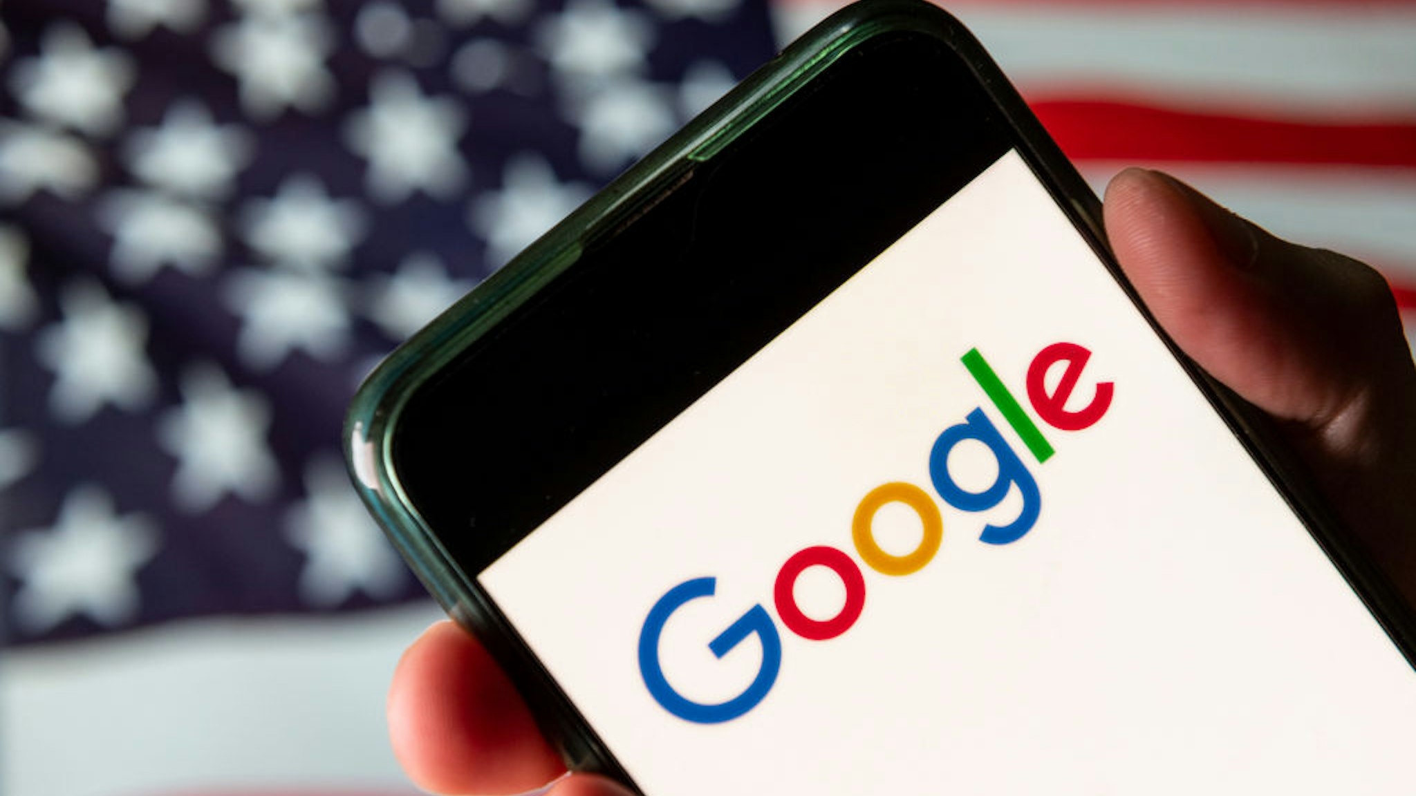 CHINA - 2020/08/13: In this photo illustration the American multinational technology company and search engine Google logo is seen on an Android mobile device with United States of America flag in the background. (Photo Illustration by Budrul Chukrut/SOPA Images/LightRocket via Getty Images)