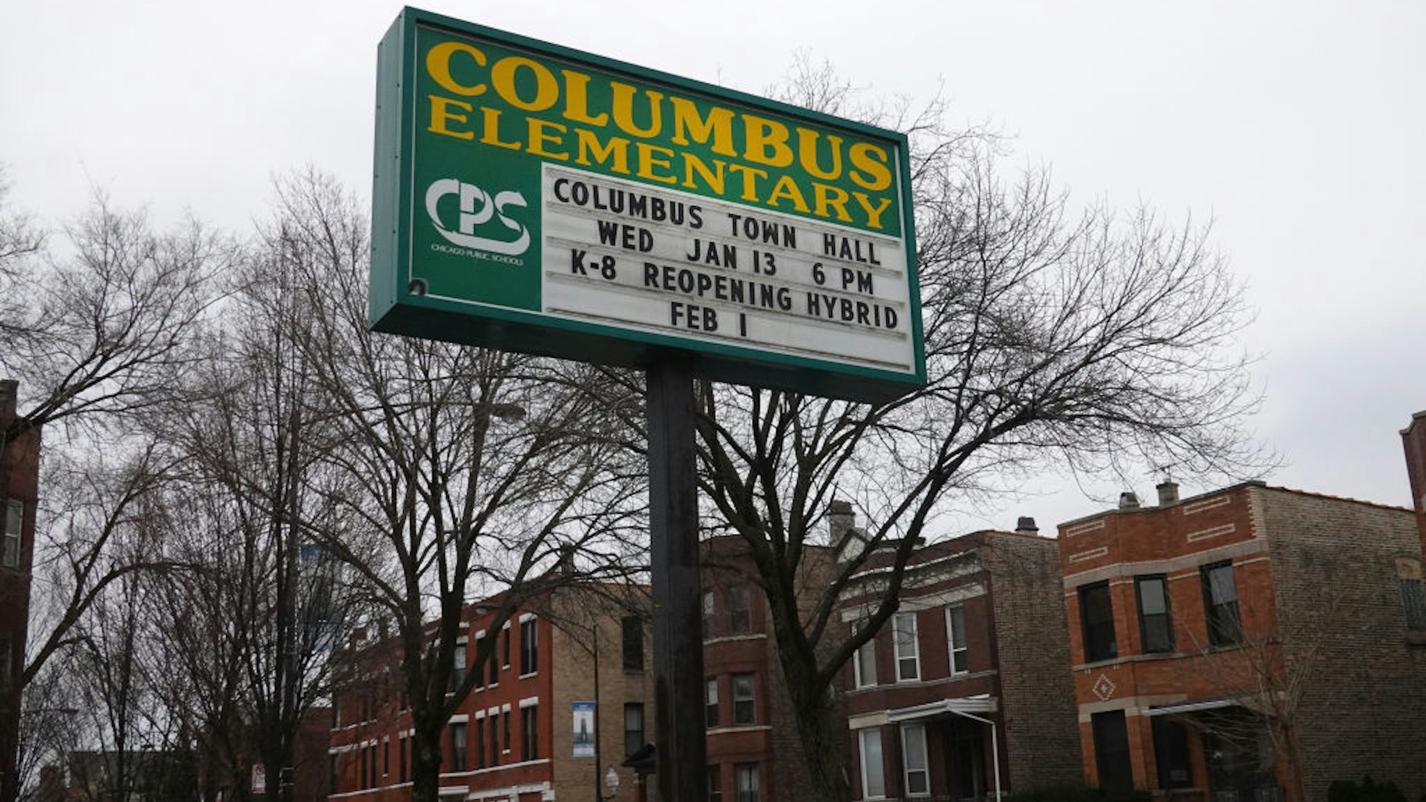 A sign outside of Columbus Elementary School delivers messages to students and parents on January 25, 2021 in Chicago, Illinois. Chicago Public School teachers were scheduled to return to the classroom for in-person learning today, but the union objected and voted to continue remote learning