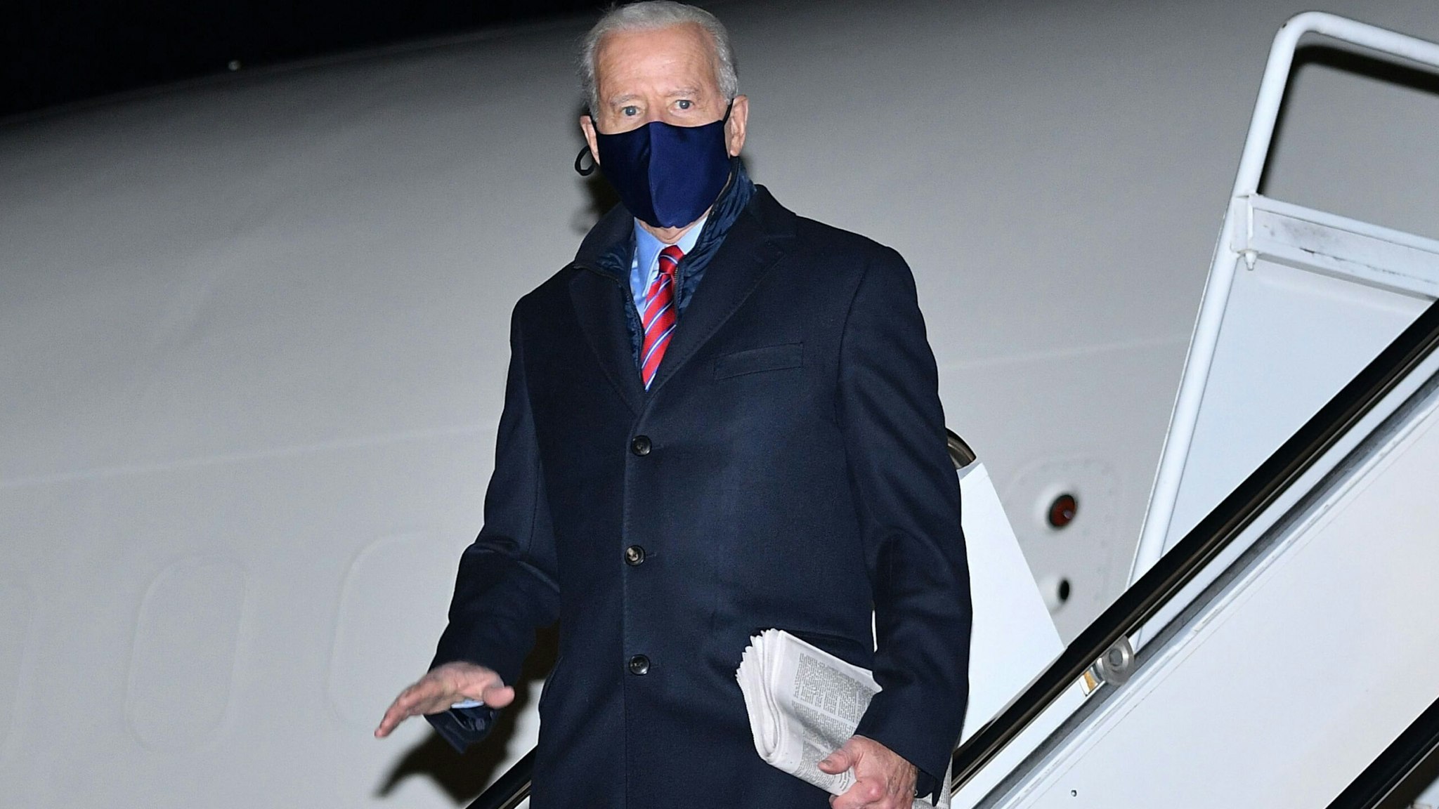 US President Joe Biden steps off Air Force One upon arrival at New Castle Airport in New Castle, Delaware on February 5, 2021. - Biden is due to spend the weekend in Wilmington, Delaware.
