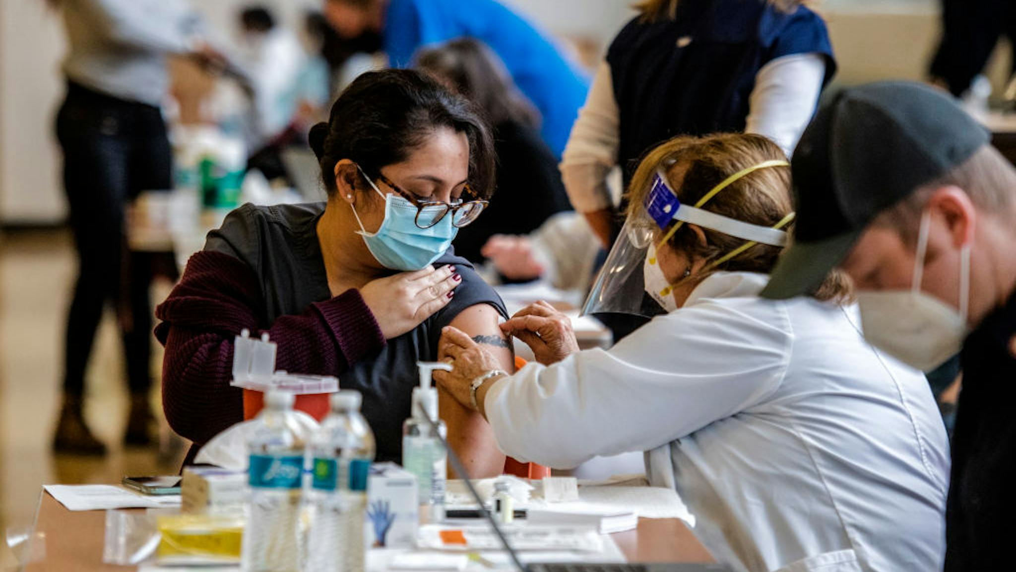 Montgomery County Vaccines Anna DaSilva, medial clinic supervisor, is prepared to receive her shot as Montgomery County administers 4,000 doses of the Moderna vaccine to healthcare workers and first responders, in Silver Spring, MD on December 30.