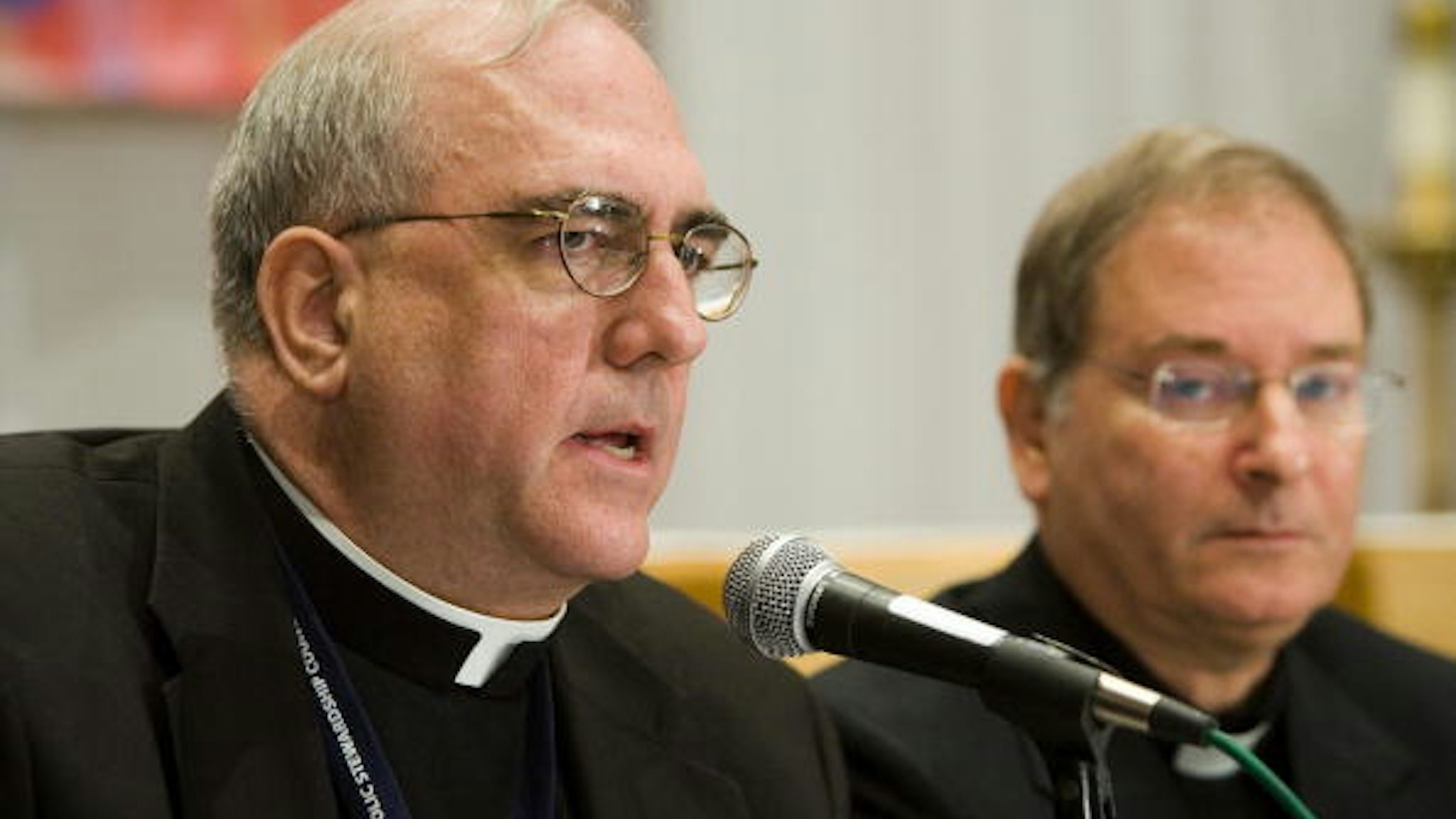 Baltimore, UNITED STATES: Archbishop of Kansas City, Kansas Josep Naumann (L) speaks at a press conference during a break from the fall meetings of the United States Conference of Catholic Bishops (USCCB) 13 November, 2006 in Baltimore, Maryland. The group of bishops from around the United States will discuss and vote on issues of interest to the Catholic Church. AFP PHOTO/Brendan SMIALOWSKI