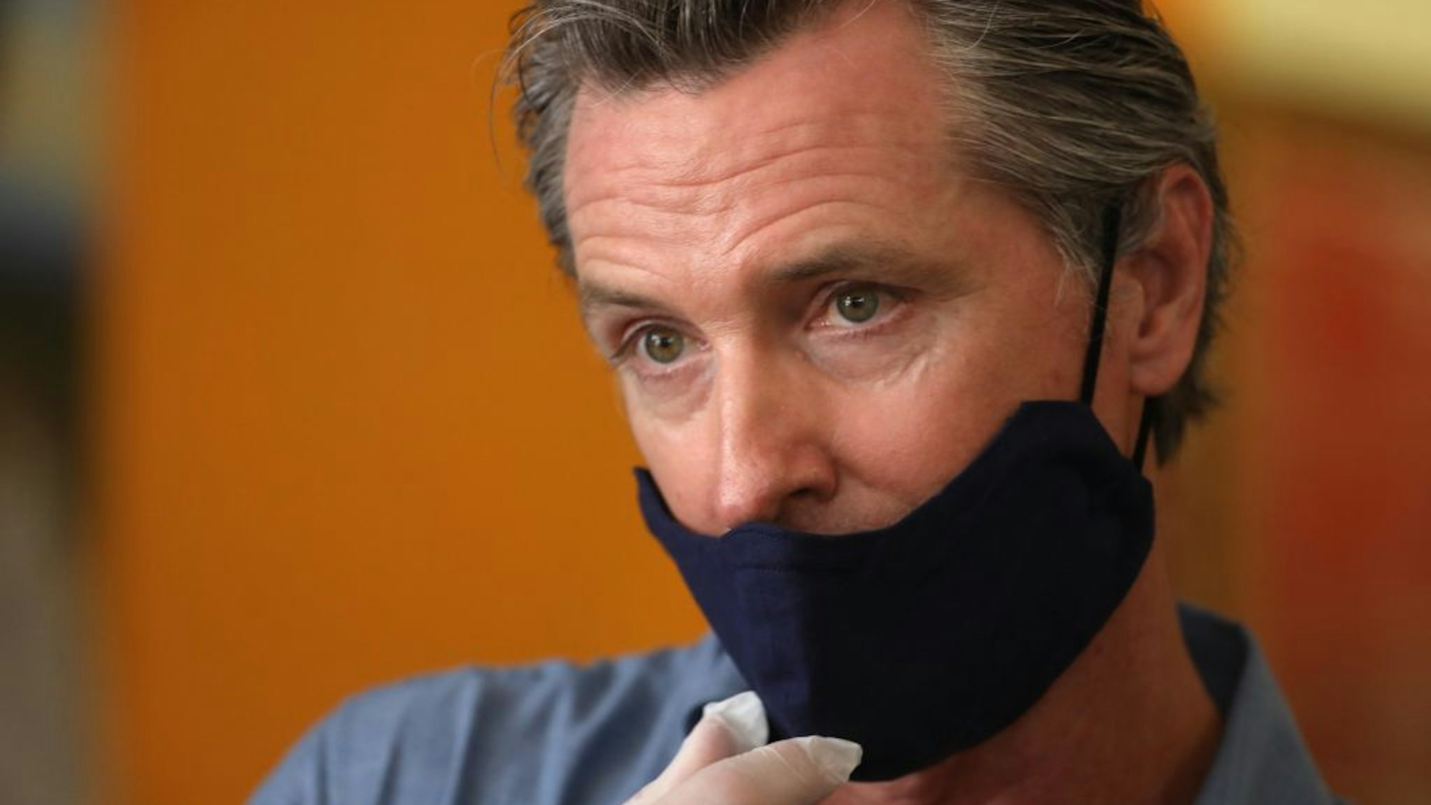 LOS ANGELES, CA - JUNE 03, 2020 - - California Governor Gavin Newsom is interviewed while visiting the Hot and Cool Cafe in Leimert Park after several days of protest in Los Angeles on June 3, 2020.