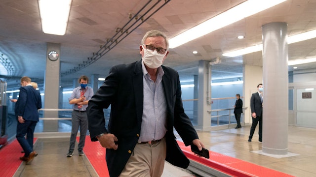 WASHINGTON, DC - DECEMBER 11: U.S. Sen. Richard Burr (R-NC) wears a protective mask while walking through the Senate Subway at the U.S. Capitol on December 11, 2020 in Washington, DC. The Senate passed a one week stop-gap bill on Friday, avoiding a partial government shutdown.