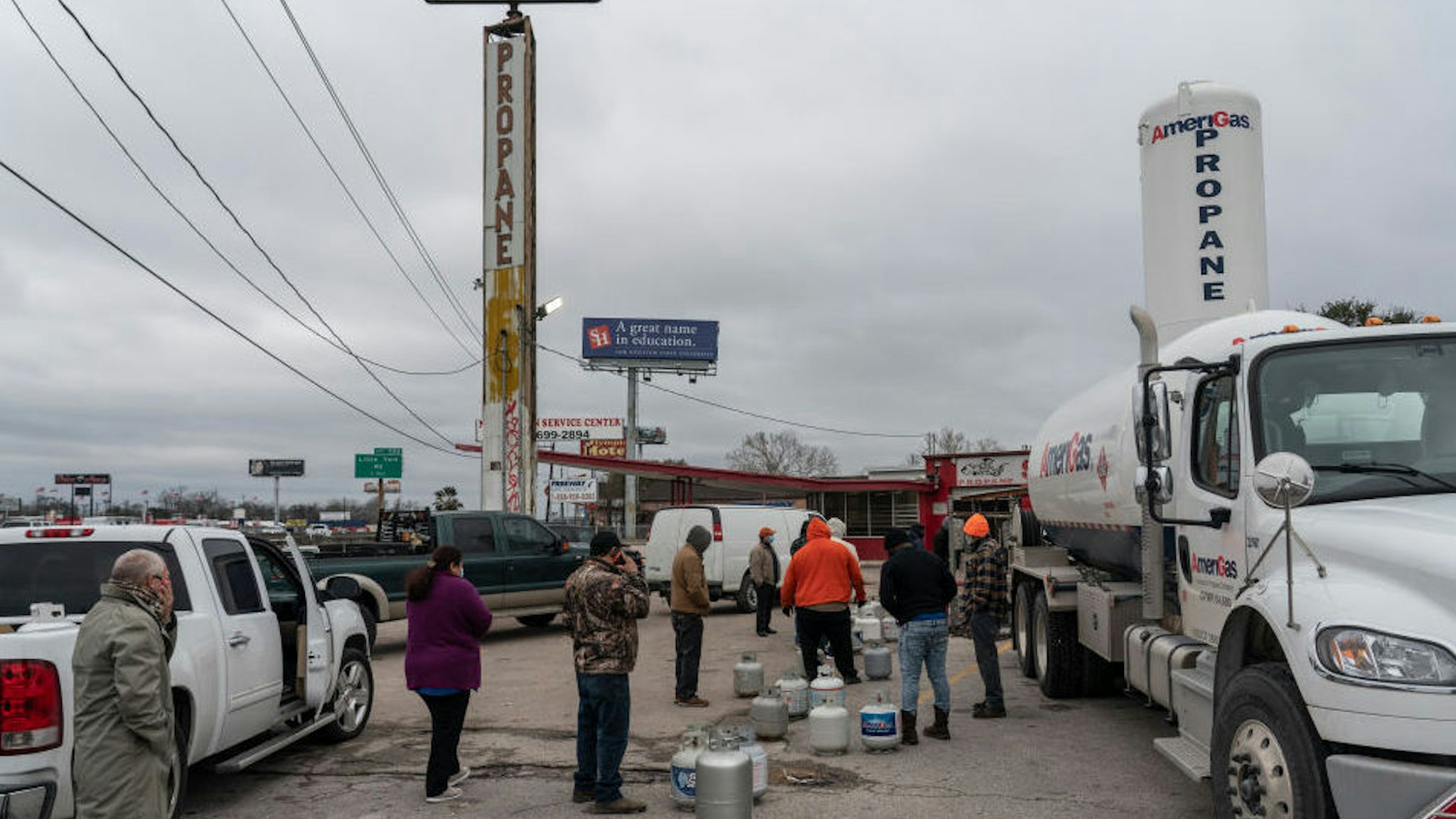 HOUSTON, TX - FEBRUARY 18: People line up at a propane gas station to refill their tanks after winter weather caused electricity blackouts on February 18, 2021 in Houston, Texas. Winter storm Uri brought severe temperature drops causing a catastrophic failure of the power grid in Texas. About two million people are without electricity throughout Houston.