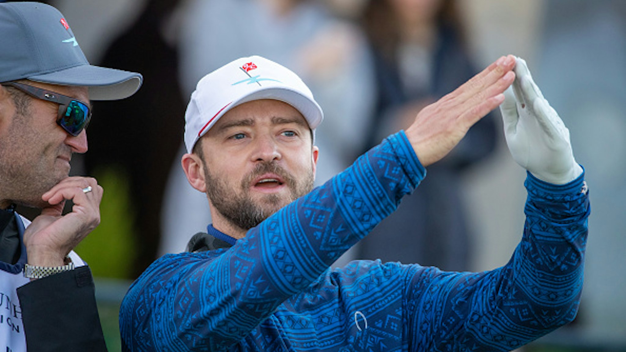 Justin Timberlake chats with his caddy before teeing off during day three of the Alfred Dunhill Links Championship at St Andrews.