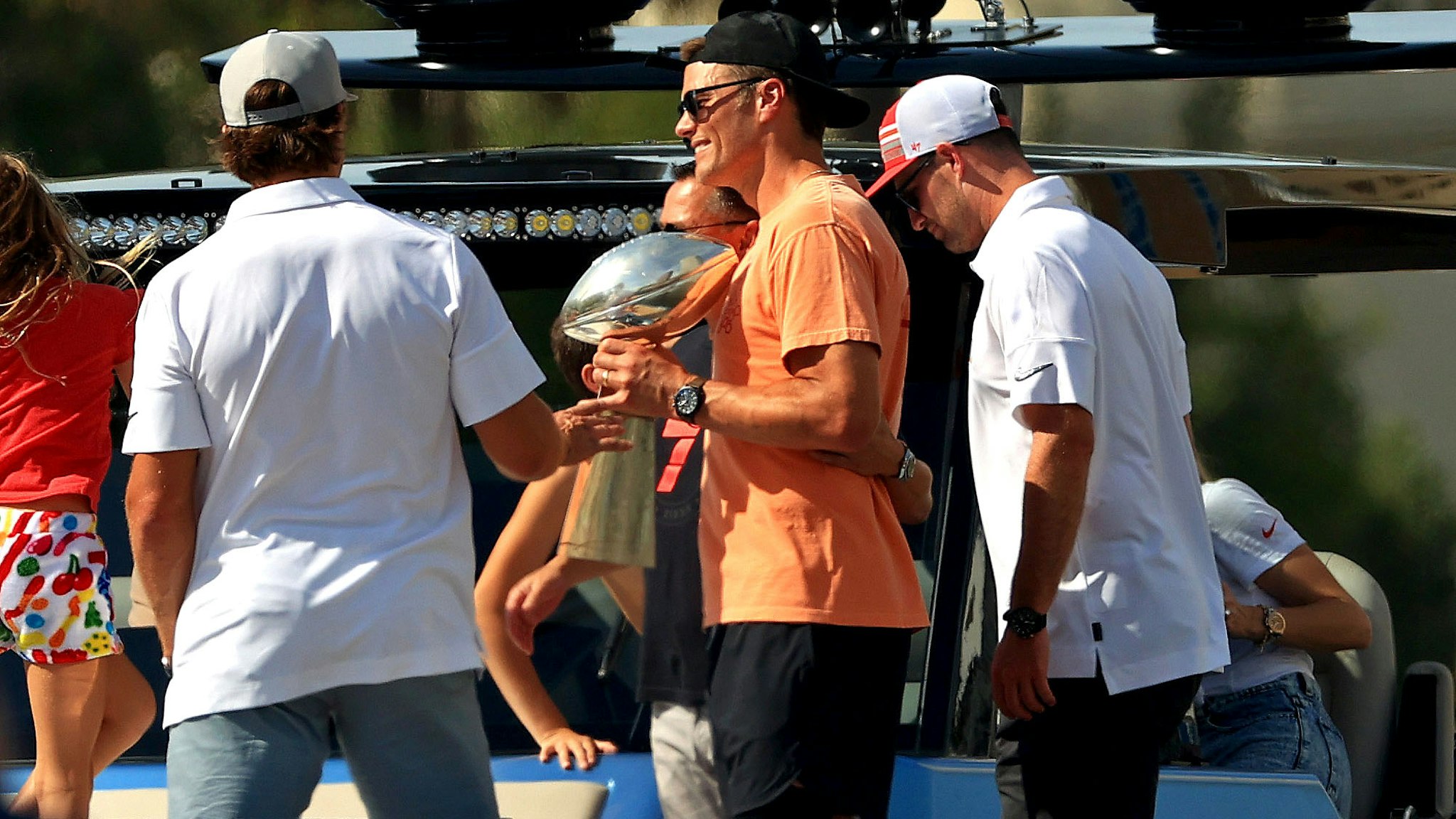 TAMPA, FLORIDA - FEBRUARY 10: Tom Brady #12 of the Tampa Bay Buccaneers celebrates their Super Bowl LV victory with the Vince Lombardi trophy during a boat parade through the city on February 10, 2021 in Tampa, Florida.
