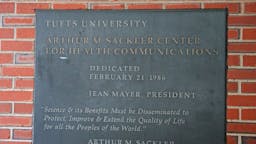 Tufts University The Sackler family name is displayed on a sign about to be removed at the Tufts building at 145 Harrison Ave. in Boston on Dec. 5, 2019. Tufts University on Thursday became the first major university to strip the Sackler name from buildings and programs, after months-long conversations and a report that censured the school for its relationship with the family behind OxyContin, an opioid blamed for hundreds of thousands of deaths nationwide. The Sackler family gave Tufts $15 million over nearly 40 years and got its name prominently displayed throughout the universitys Boston health sciences campus - on the graduate school of biomedical sciences, on the center for medical education, and on laboratories and research funds. While there is no evidence that the financial relationship, which ended in 2016, materially affected academics, there was an appearance of too close a relationship between Purdue, the Sacklers, and Tufts, the outside report by former US attorney Donald K. Stern found. And the company was successful in exercising influence, whether directly or indirectly.