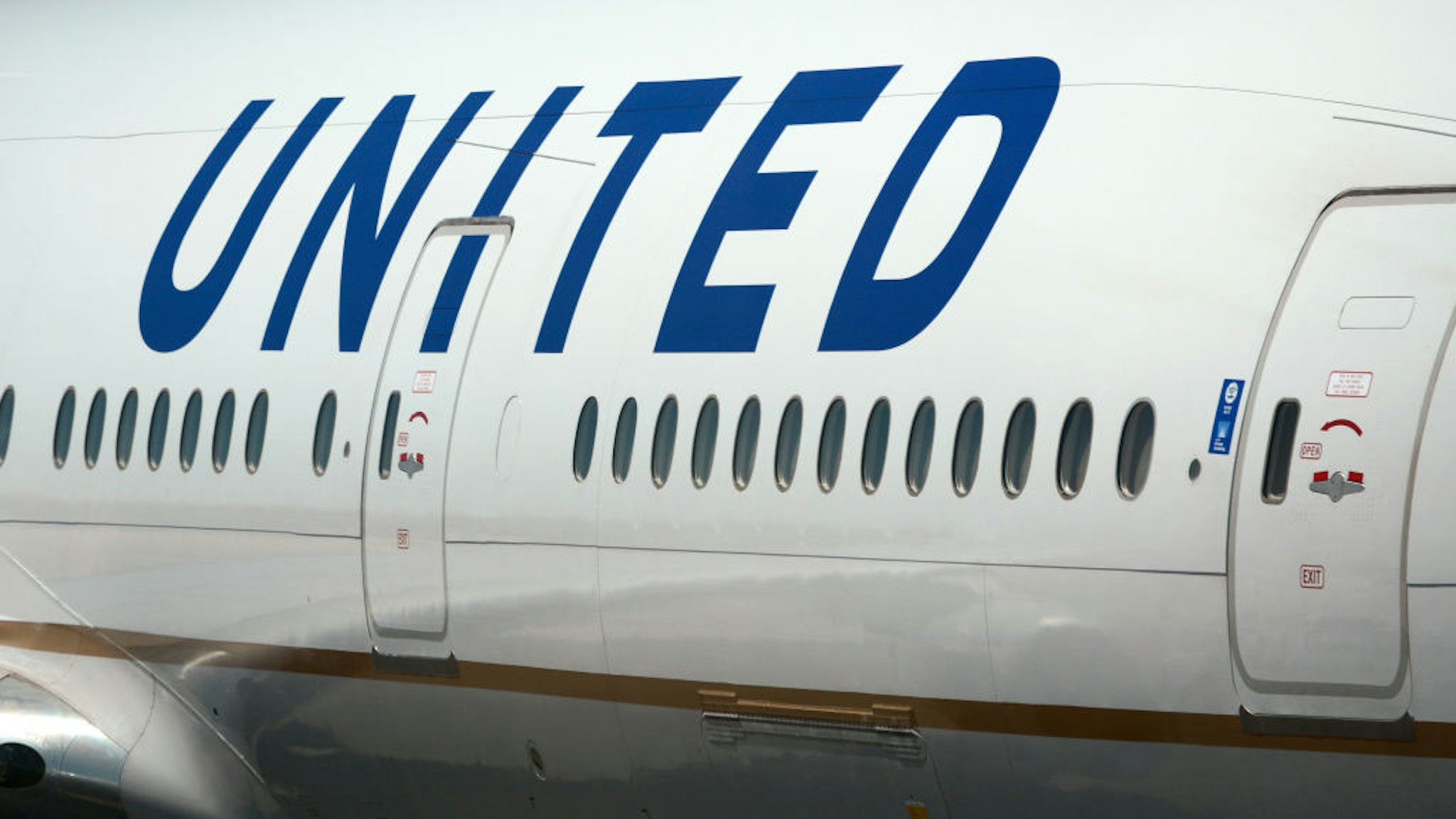 DENVER, COLORADO - JUNE 20, 2019: A United Airlines Boeing 777 passenger aircraft at Denver International Airport in Denver, Colorado.