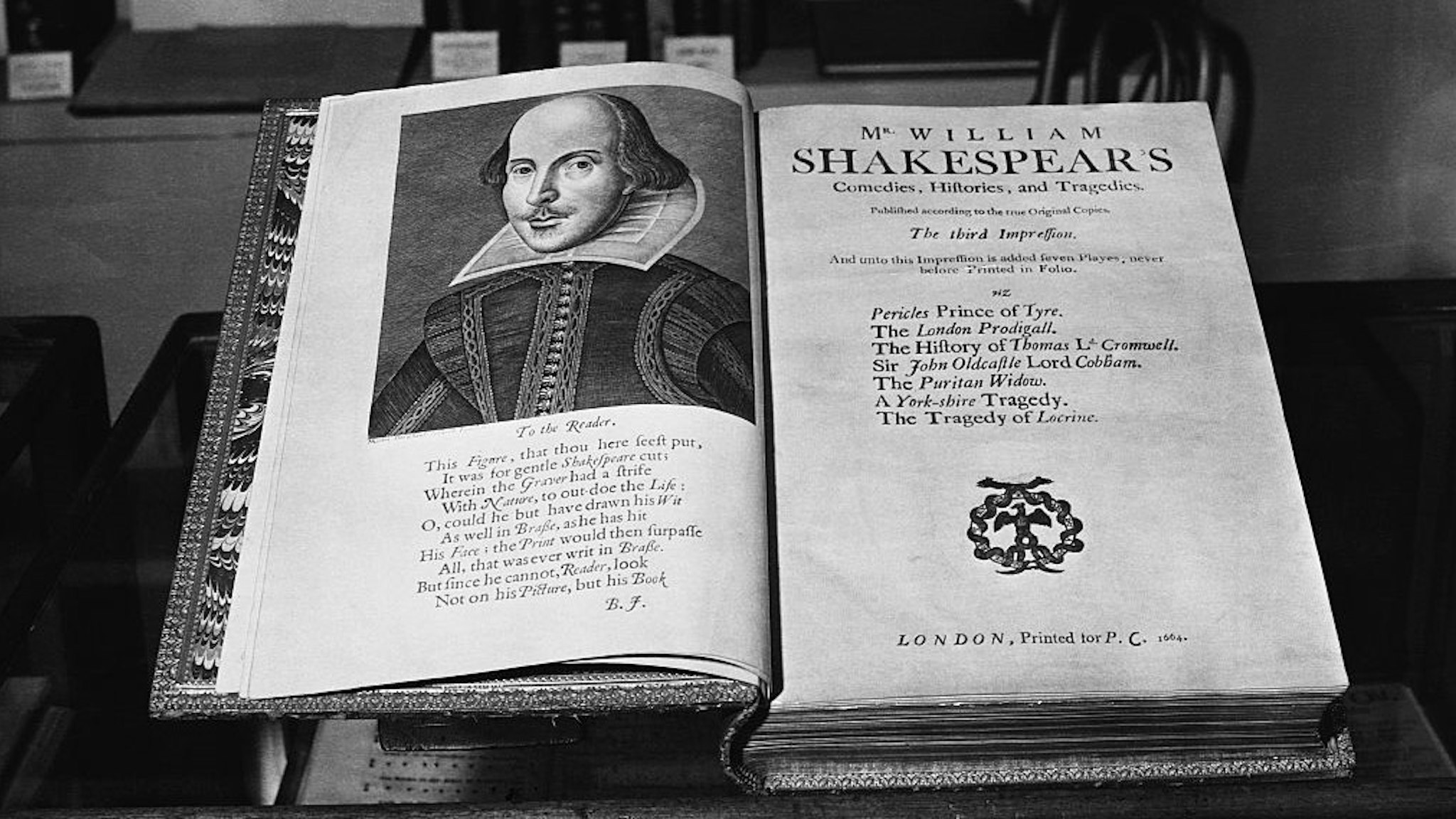 (Original Caption) The twelfth Antiques Dealers' Fair and Exhibition is to be opened tomorrow in the Great Hall at Grosvenor House, Park Lane, London, W., by Mrs Winston Churchill, wife of the Prime Minister. 10/6/52. Antique Dealers' Fair: a copy of the third Folio edition of Shakespeare. Printed in 1664. (Photo by ©