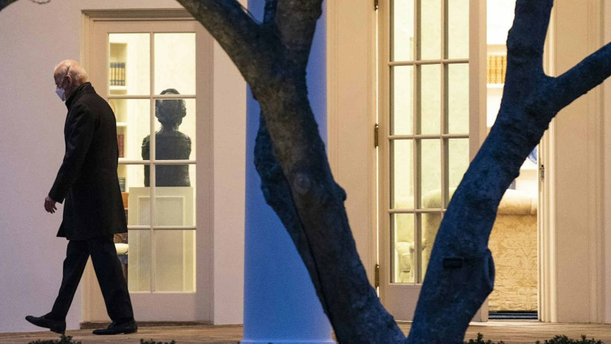 U.S. President Joe Biden walks from the Oval Office of the White House before boarding Marine One in Washington, D.C., U.S., on Friday, Feb. 12, 2021. The Biden administration slowly will begin to admit into the U.S. asylum seekers who were turned away by the Trump administration under the so-called Remain in Mexico policy. Photographer: