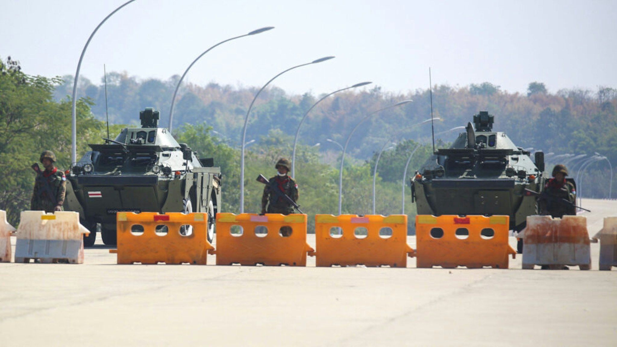 NAYPYIDAW, MYANMAR - FEBRUARY 01: Military soldiers with tanks and police truck block the road near parliament in Naypyidaw this afternoon in Myanmar on February 1, 2021. Myanmar's military announced Monday that it has seized power and will rule the country for at least one year after detaining its top political leaders.