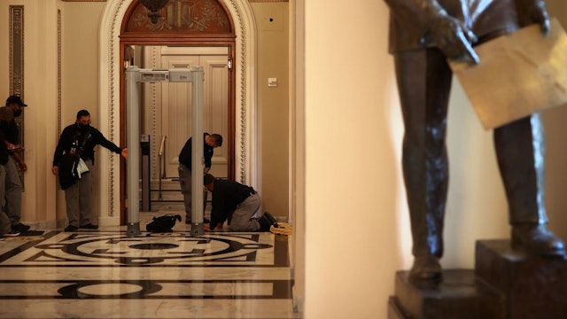 WASHINGTON, DC - JANUARY 12: U.S. Capitol Police install a metal detector at the doors of the House of Representatives Chamber January 12, 2021 in Washington, DC. At the direction of President Donald Trump, a mob attacked the U.S. Capitol on January 6 and security has been tightened ahead of next week’s presidential inauguration. (Photo by