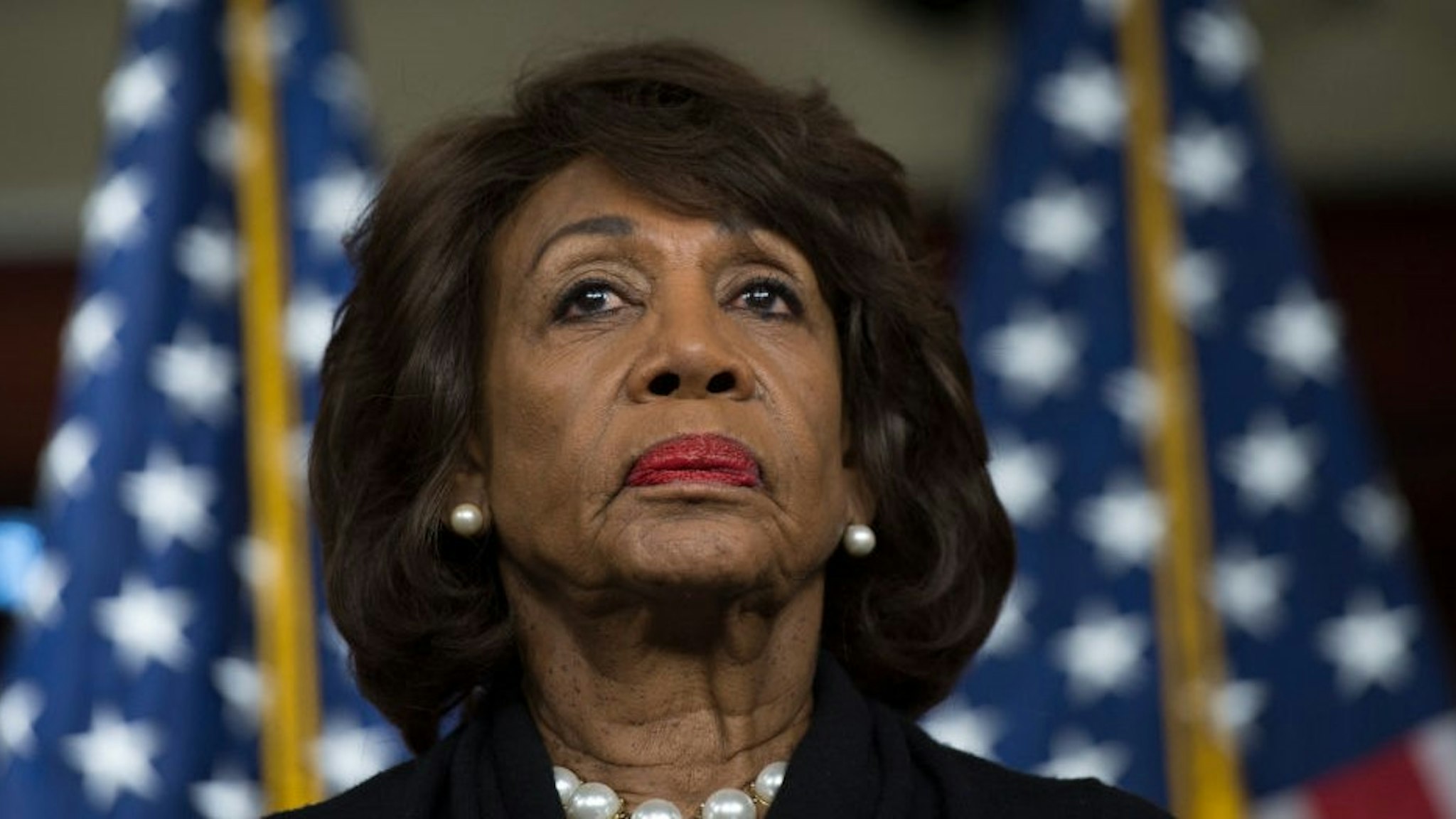 US Representative Maxine Waters (D-CA) looks on before speaking to reports regarding the Russia investigation on Capitol Hill in Washington, DC on January 9, 2018. (Photo by Andrew CABALLERO-REYNOLDS / AFP) (Photo by