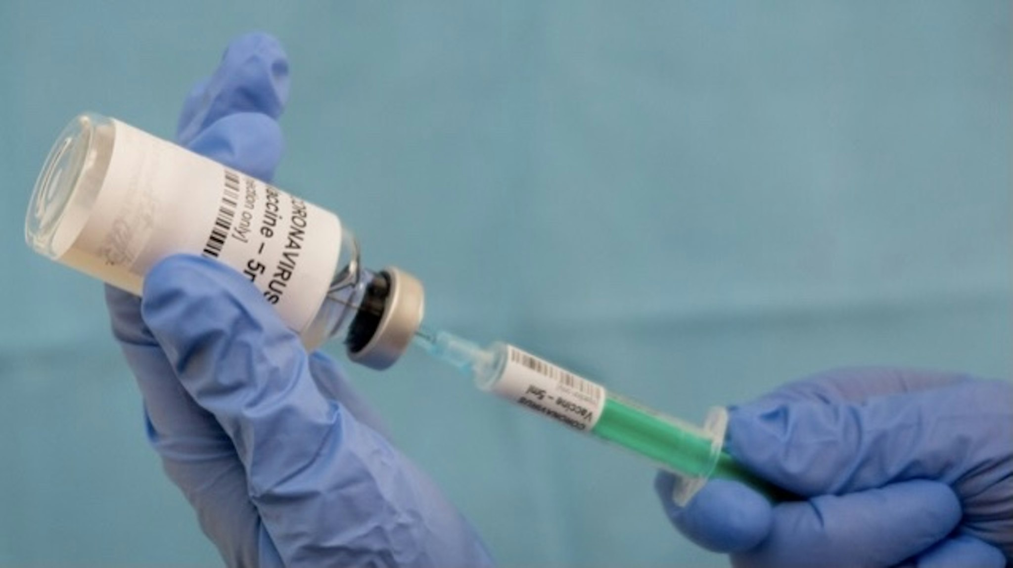 Infectious doctor fills injection syringe with CO-VID 19 vaccine - concept, for prevention, immunization and treatment for new corona virus infection(COVID-19,novel coronavirus disease 2019) - stock photo The 2019–2020 coronavirus pandemic is an ongoing pandemic of coronavirus disease 2019 (COVID-19), caused by severe acute respiratory syndrome coronavirus 2 (SARS-CoV-2).