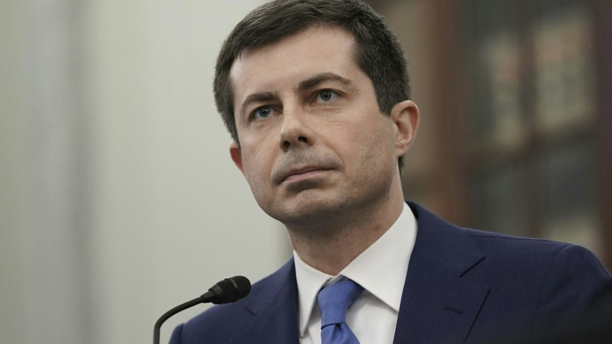 Pete Buttigieg, U.S. secretary of transportation nominee for U.S. President Joe Biden, listens during a Senate Commerce, Science and Transportation Committee confirmation hearing in Washington, D.C., U.S., on Thursday, Jan. 21, 2021. Buttigieg, is pledging to carry out the administration's ambitious agenda to rebuild the n sation's infrastructure, calling it a "generational opportunity" to create new jobs, fight economic inequality and stem climate change. Photographer: Stefani Reynolds/Bloomberg