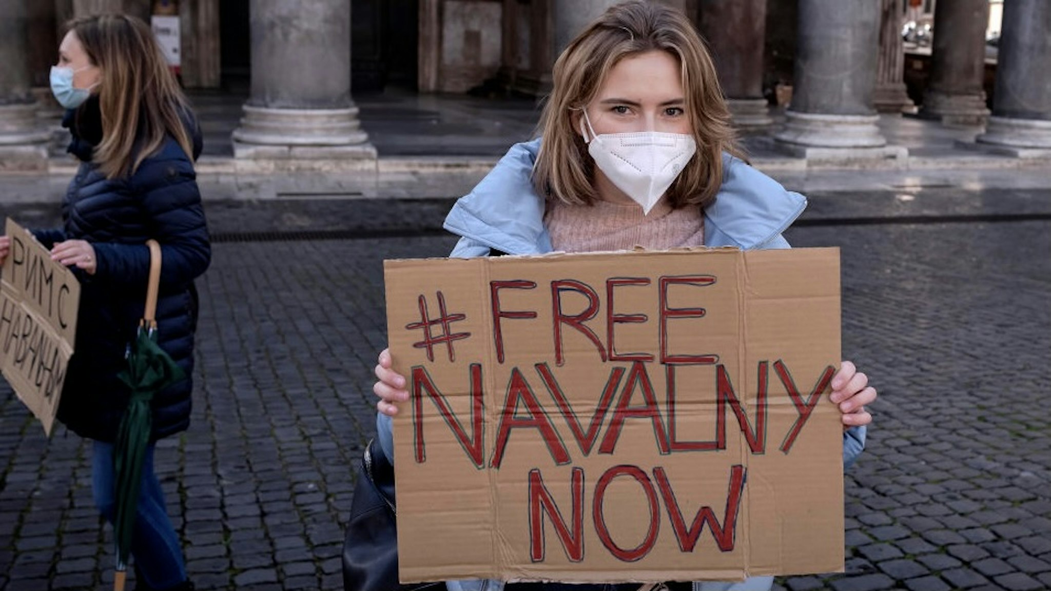 ROME, ITALY - JANUARY 23: Supporters of Russian opposition politician Alexei Navalny gather in the downtown to protest for his release from prison on January 23, 2021 in Rome, Italy. Earlier this week, Kremlin-critic Alexei Navalny called for supporters to protest after he was remanded to pre-trial detention for 30 days. His arrest came one day after his return to Russia, following his poisoning with a nerve agent last summer. (Photo by Stefano Montesi - Corbis/Corbis via Getty Images)