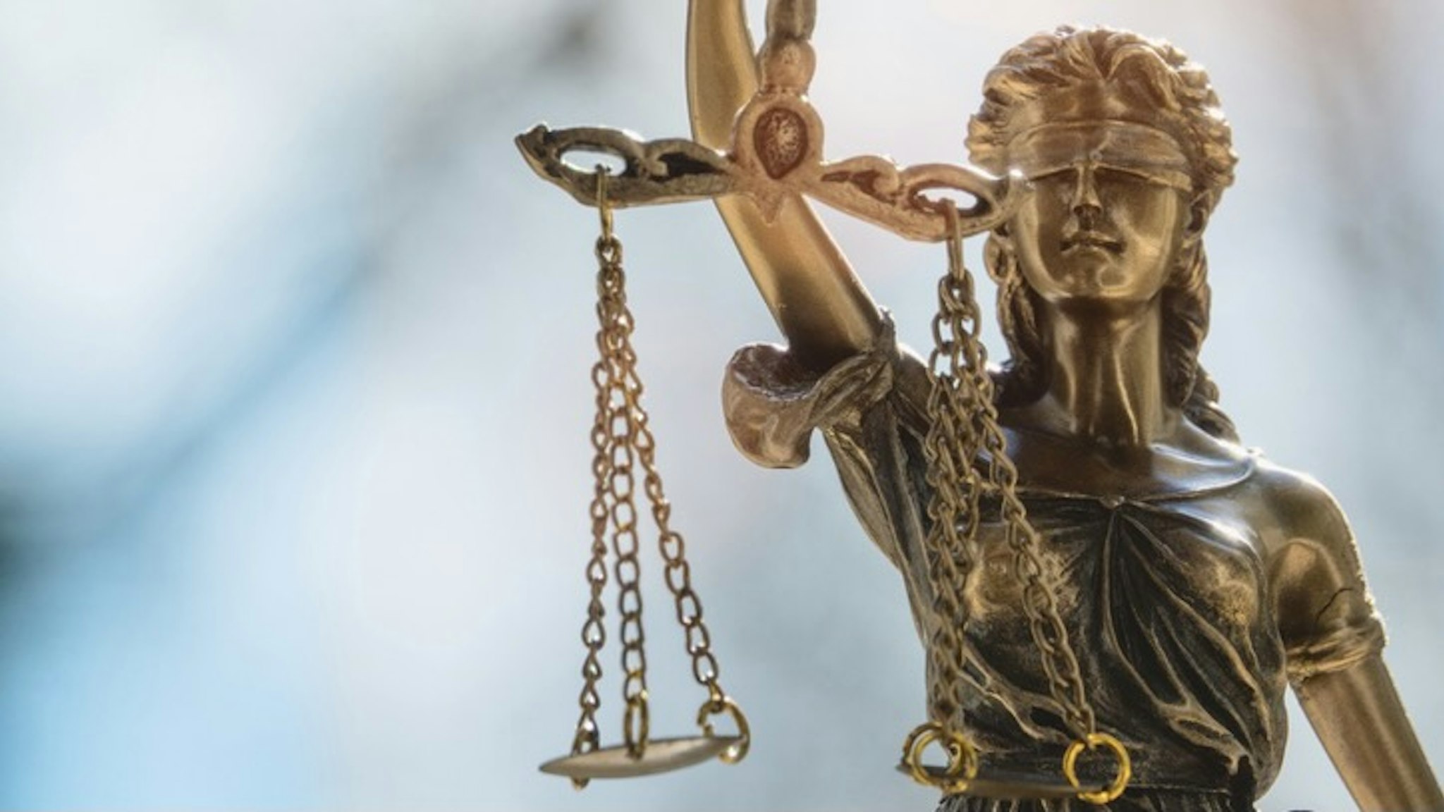 Close-Up Of Statue - stock photo Lady Justice or Justicia in front of blurred background. Goddess of justice.